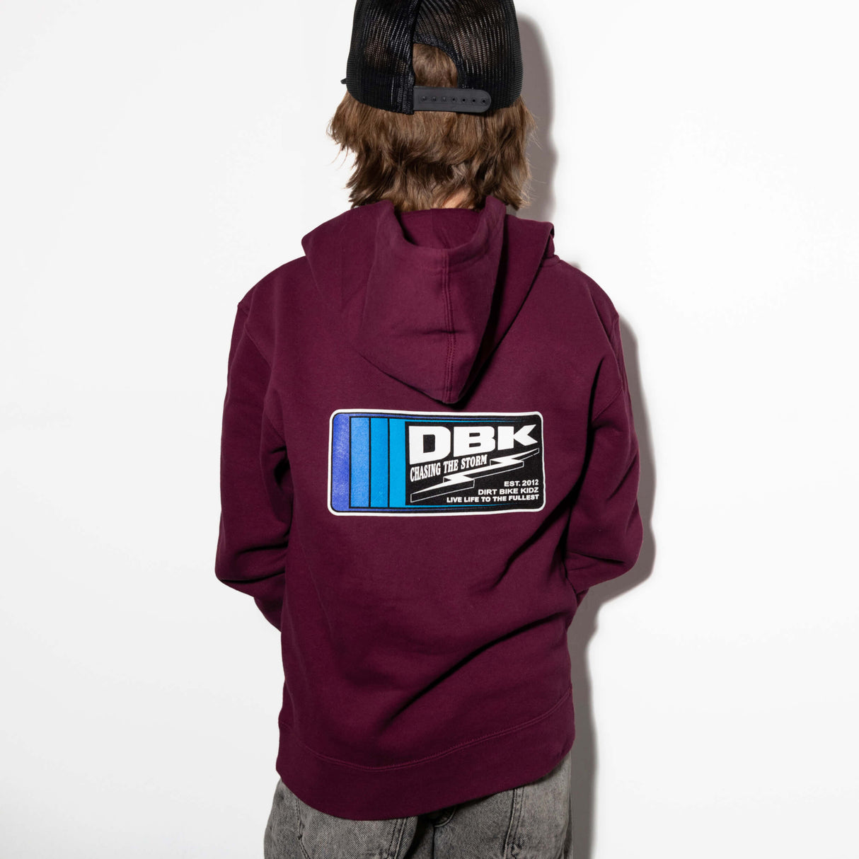 Youth maroon hoodie back view with DBK logo graphic on the center
