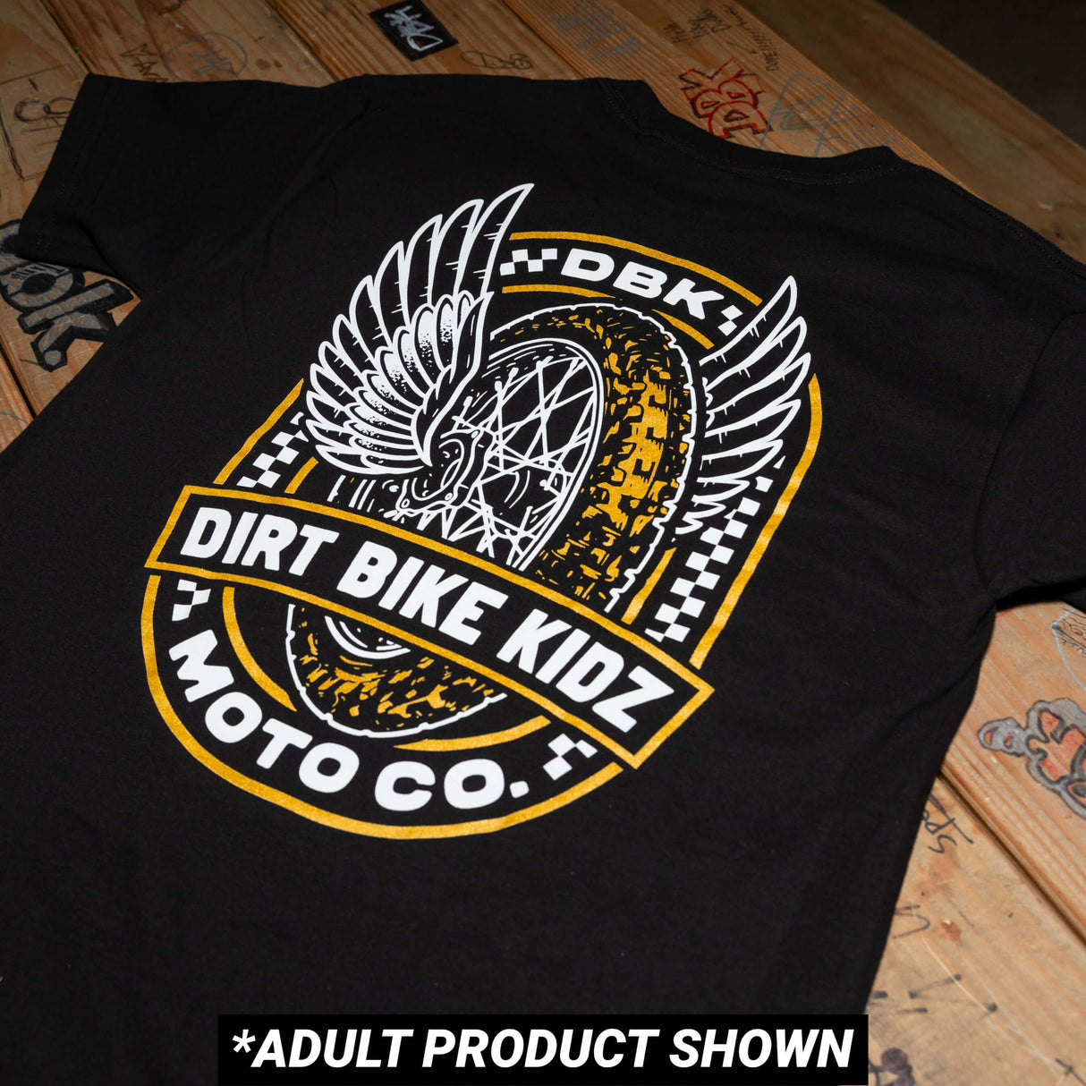 Youth premium black tee with Dirt Bike Kidz Moto Co winged back graphic.