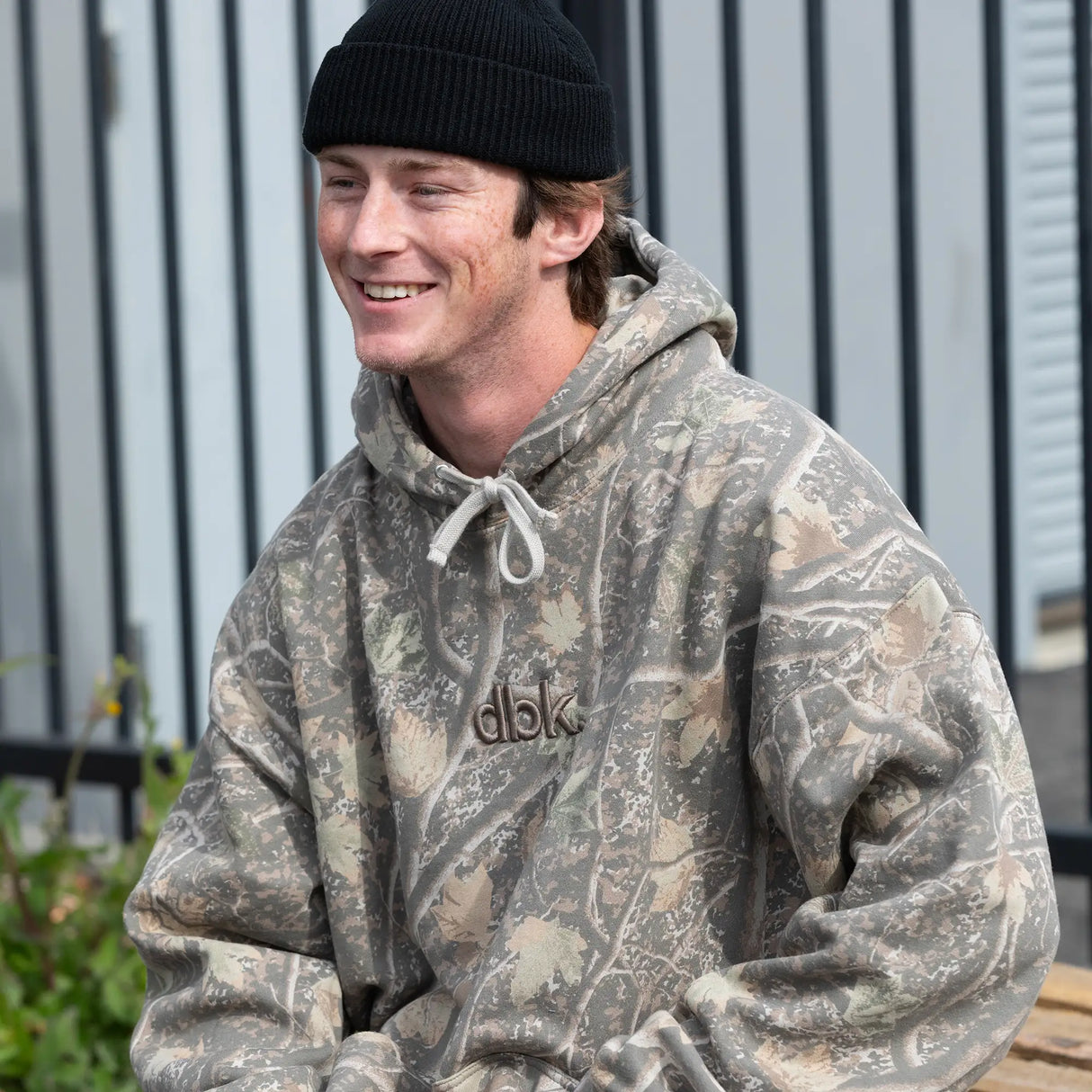 Camouflage hoodie with hood and white drawstrings, dbk logo on the chest