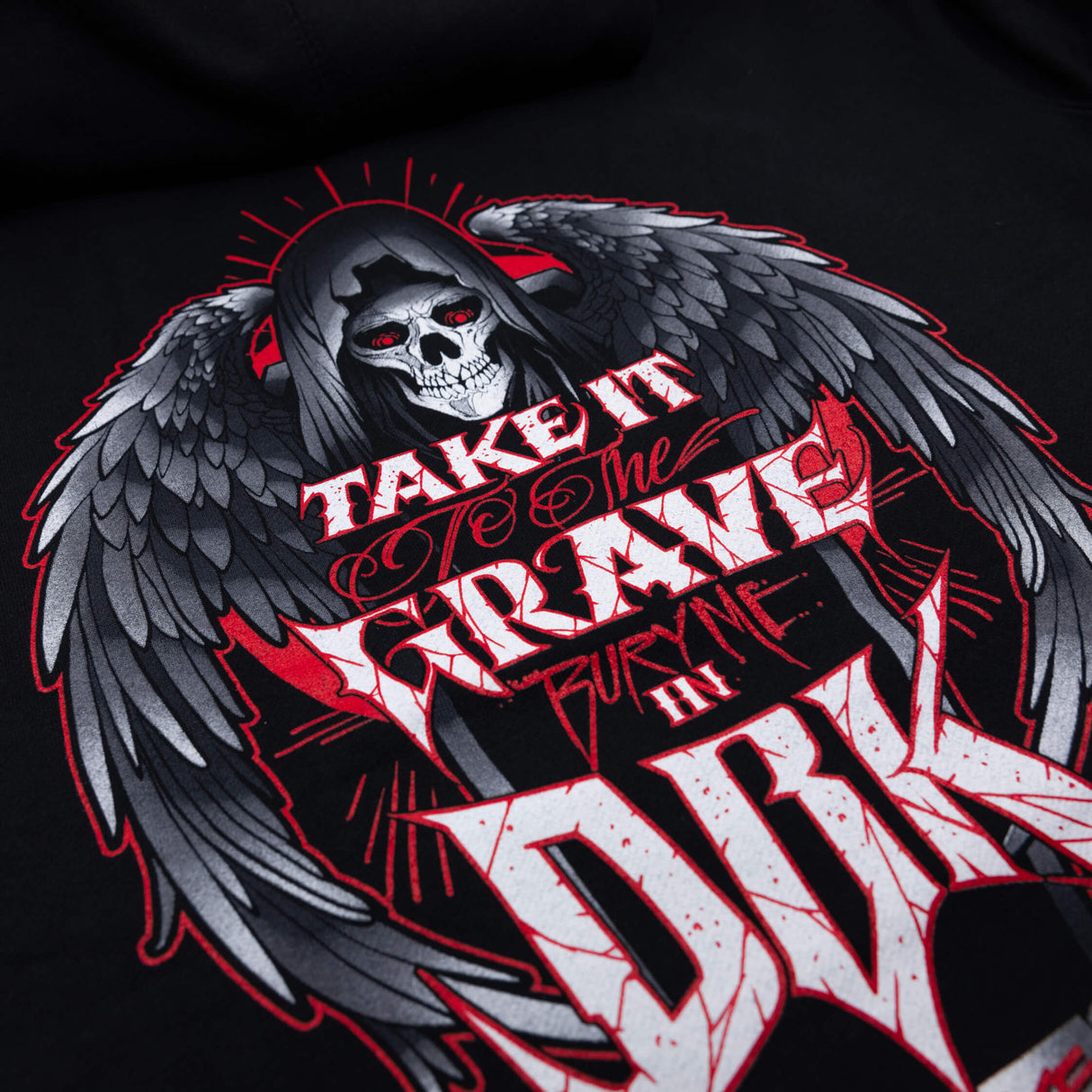 Black hoodie back graphic close-up with winged skull and large white lettering