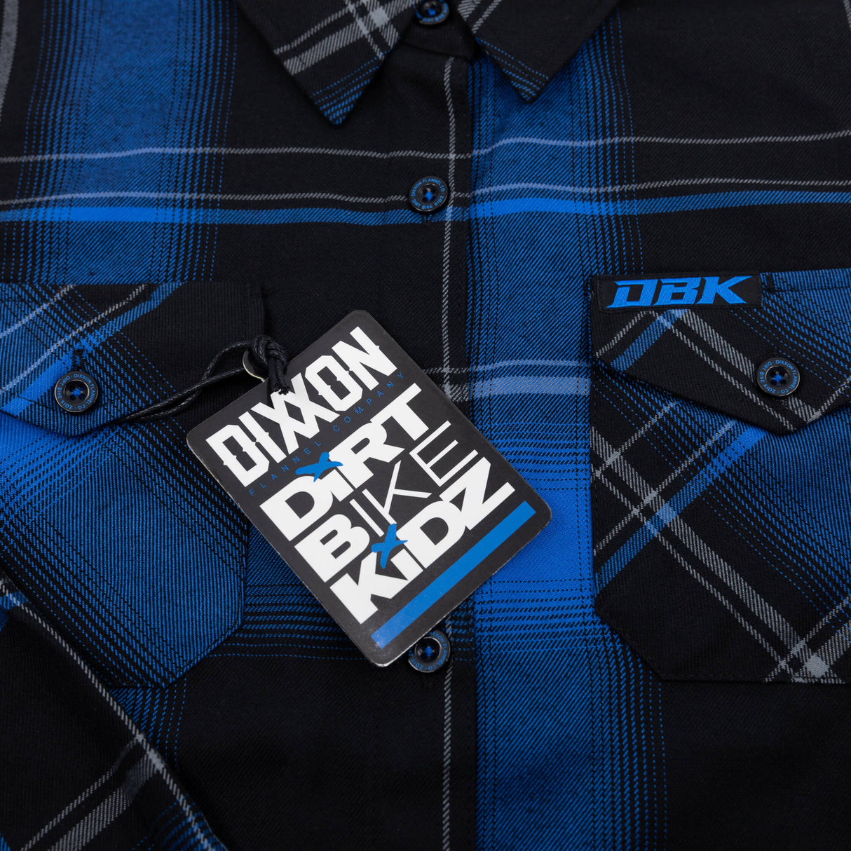 Blue-and-black plaid flannel shirt with DBK logo patch on chest pocket