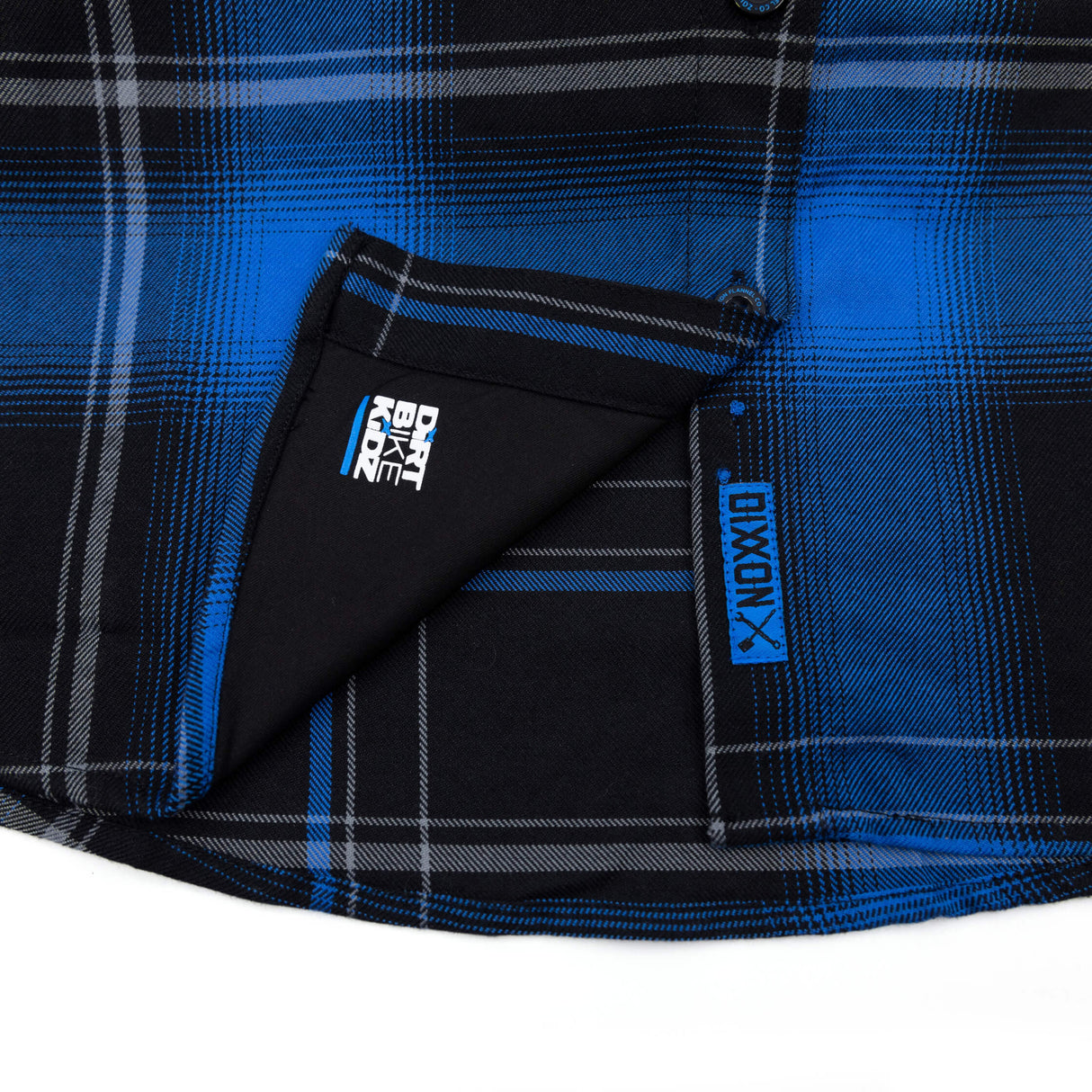 Blue-and-black plaid flannel shirt inner panel with DBK logo patch