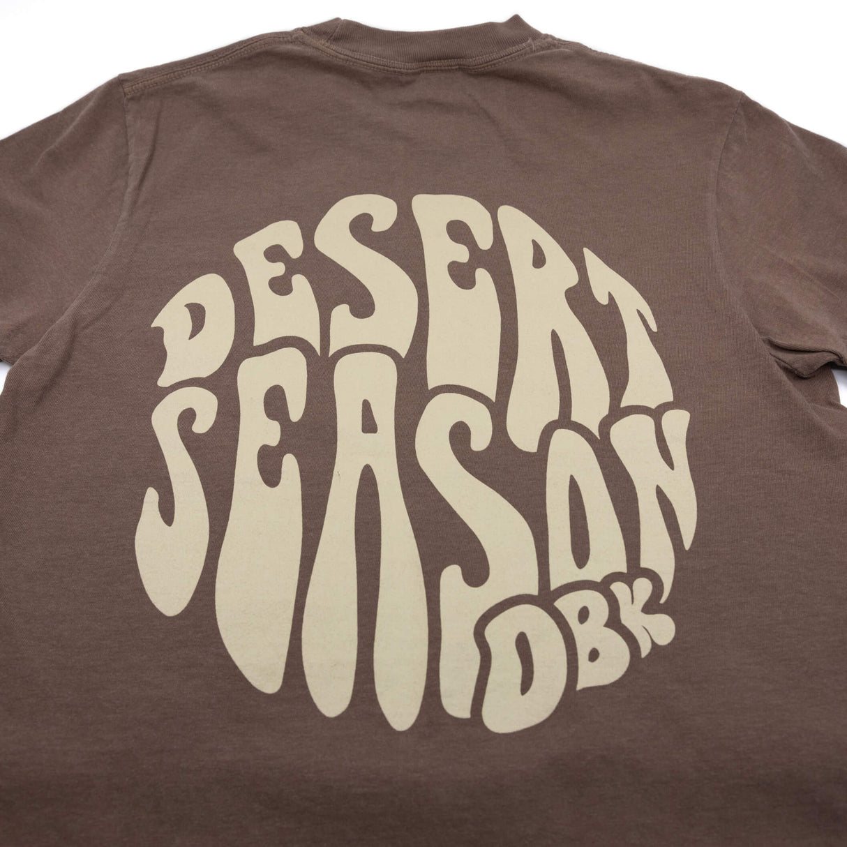 Brown womens crew-neck T-shirt with large Desert Season logo on back