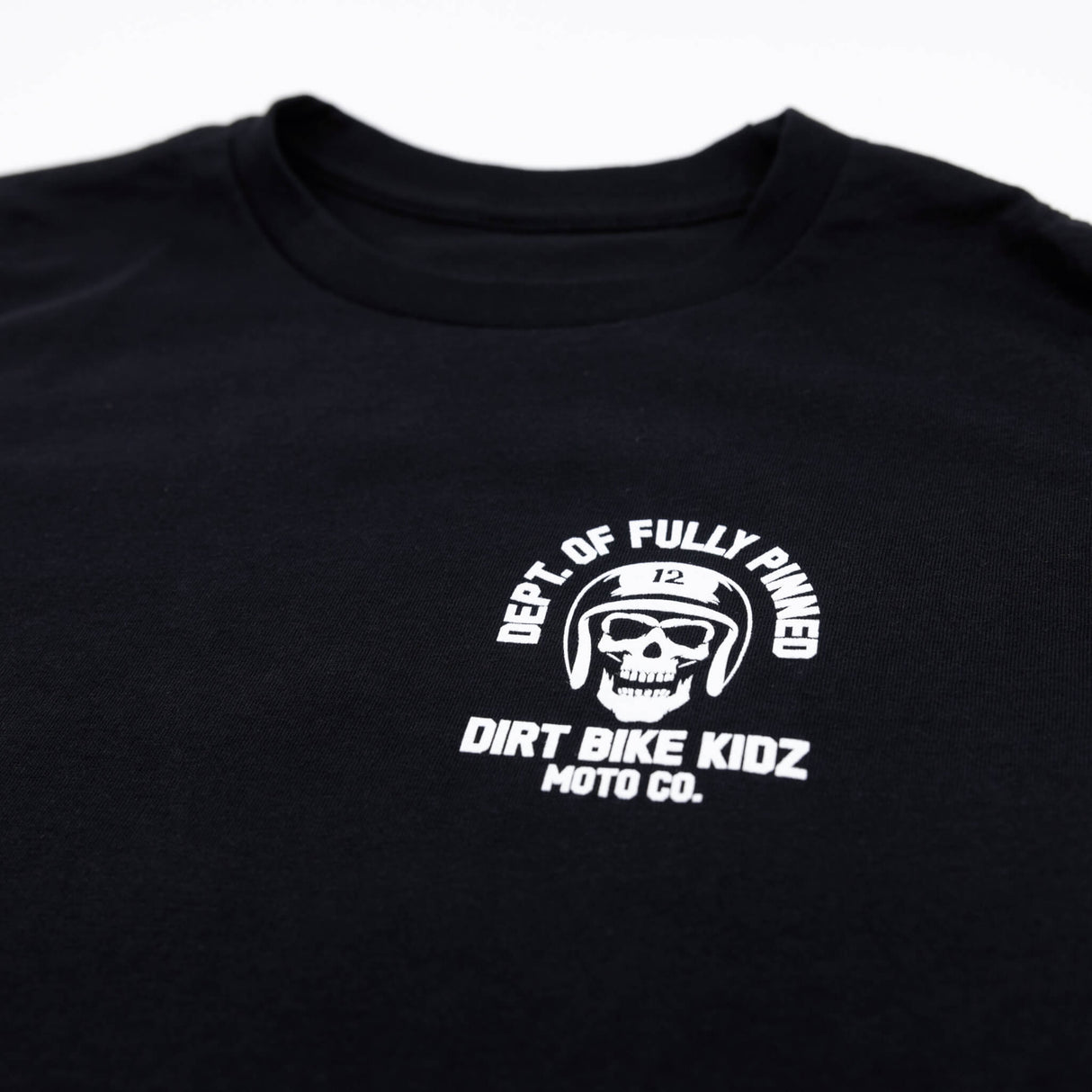 Youth premium black T-shirt featuring centered white skull helmet logo with text