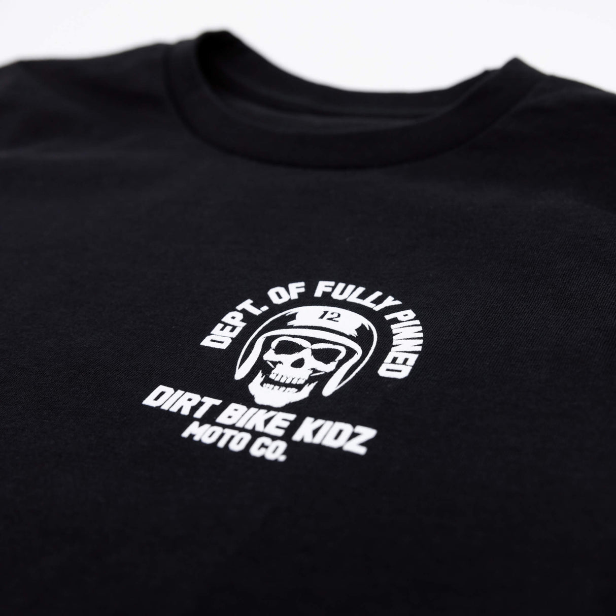 Youth premium black T-shirt left chest logo with “DEPT. OF FULLY PINNED” and skull