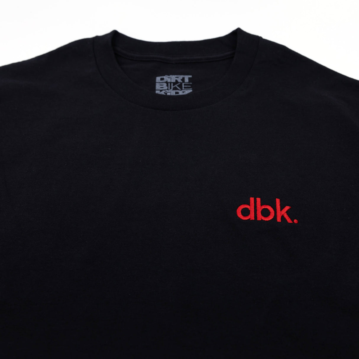 Black crew T-shirt with red dbk logo; crew neck tag visible