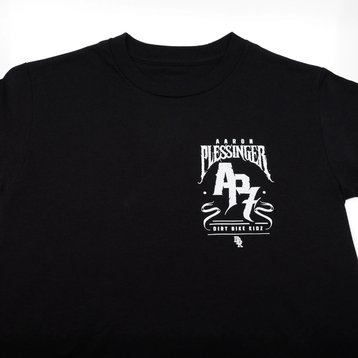 Black T-shirt with white Pleasinger AP7 Dirt Bike Kid logo
