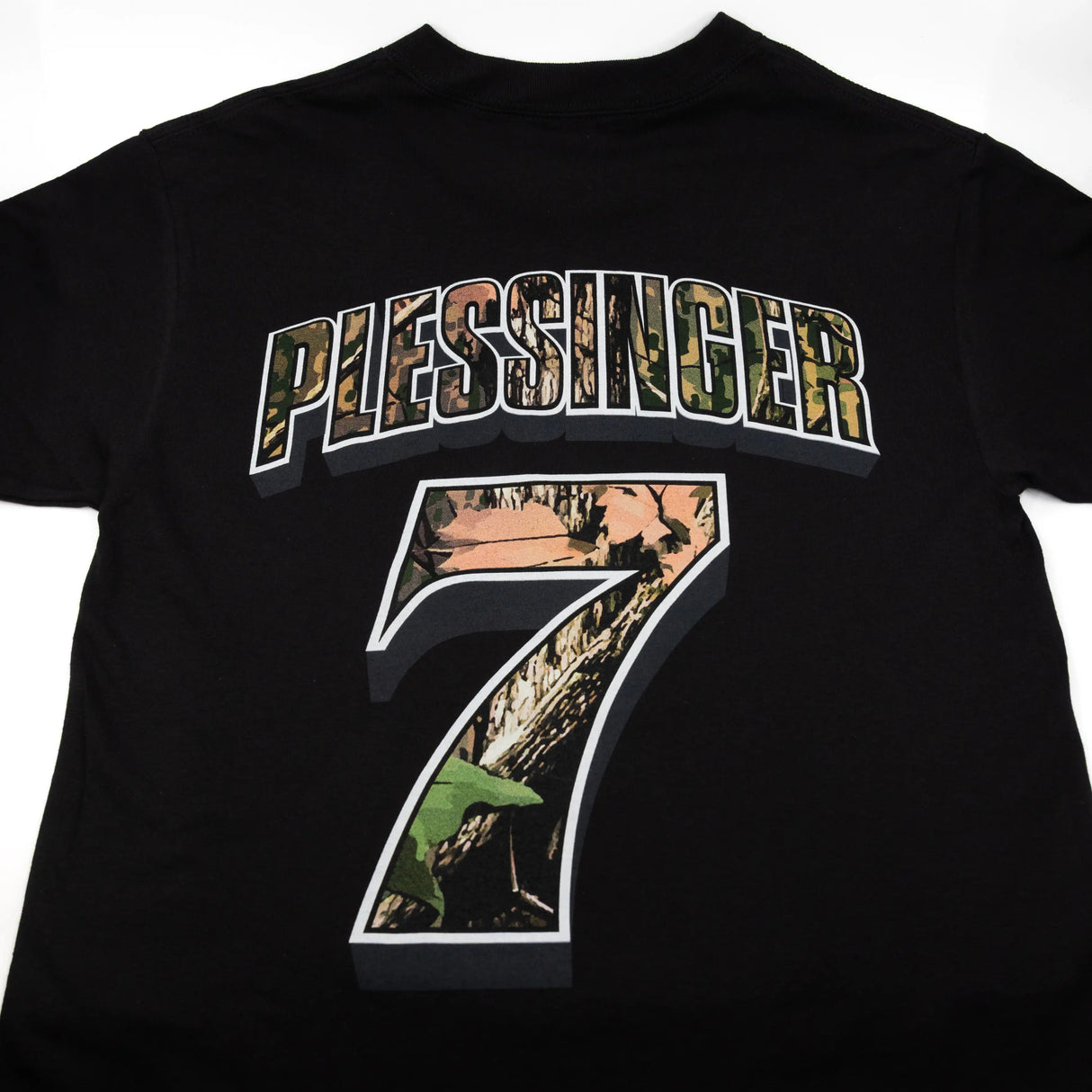 Black youth premium tee with PLESSINGER 7 back print close-up