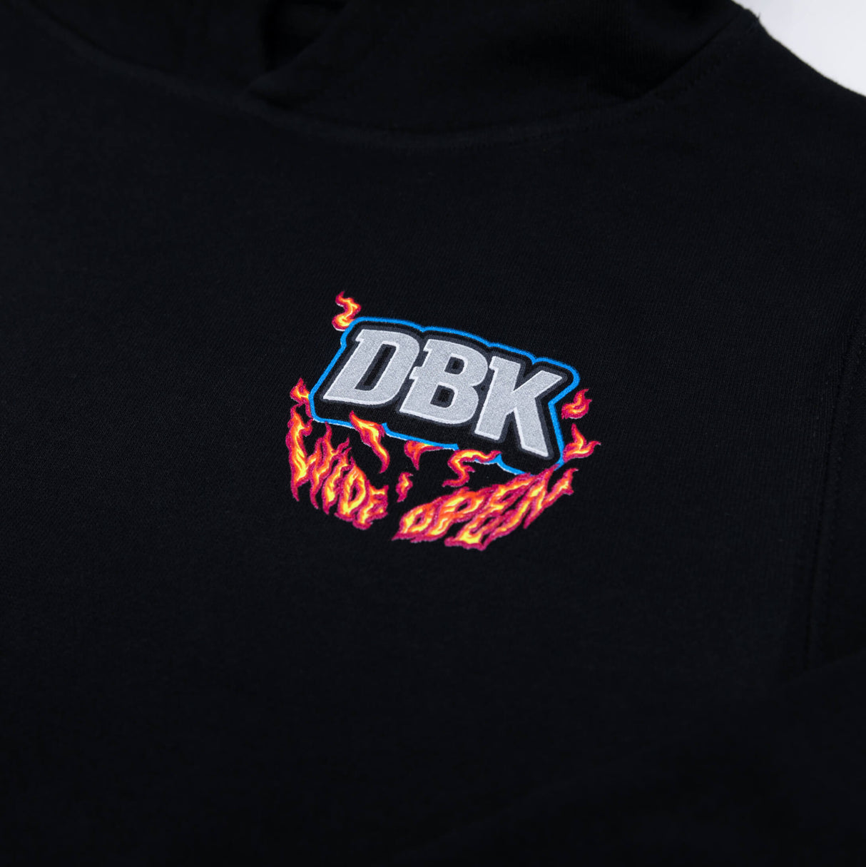 Youth black hoodie chest logo with “DBK” text and flame graphic