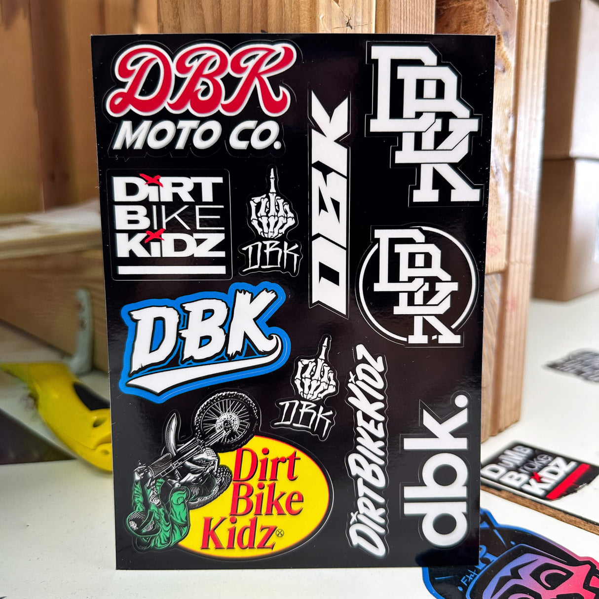Upright DBK Moto Co sticker pack with Dirt Bike Kidz and DBK logo graphics on black