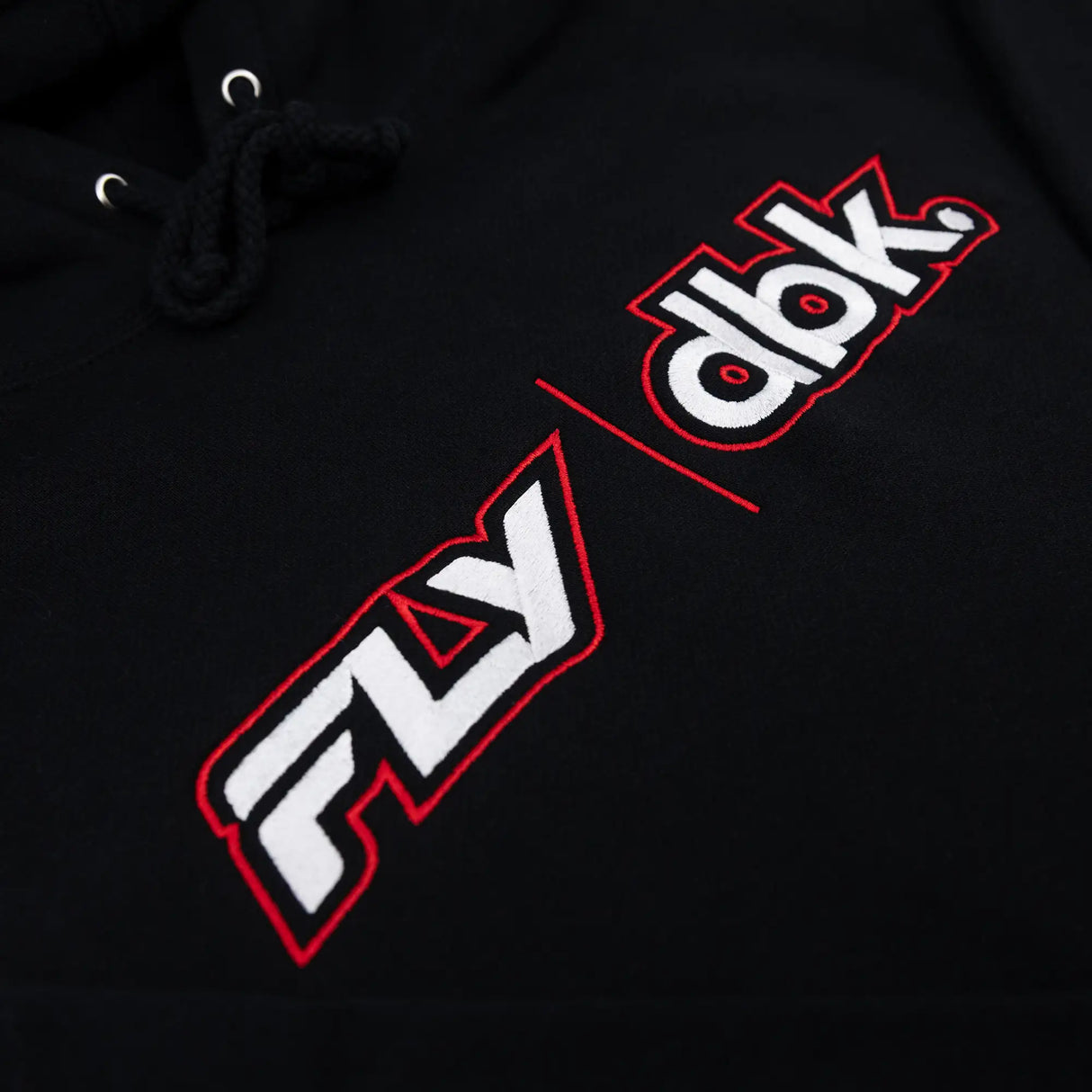 Black hoodie logo print detail with dbk letters and red outline on sleeve