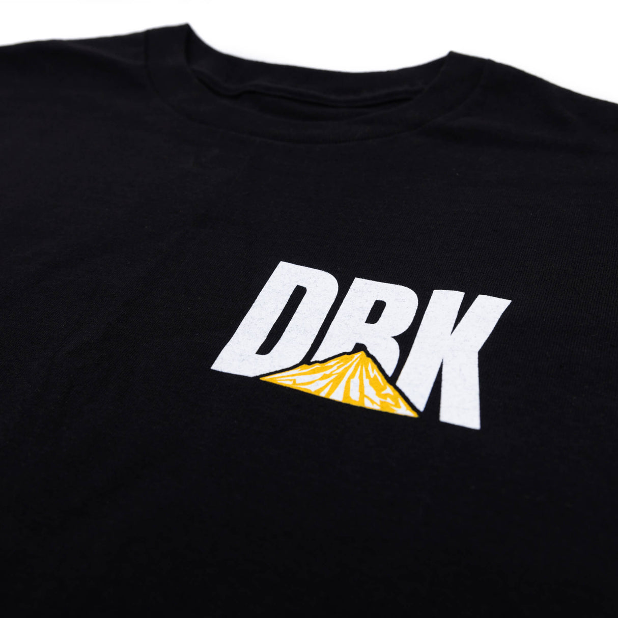 Black crewneck T-shirt with DRK logo and 'WE BUILD IT WE RIDE IT' text on back