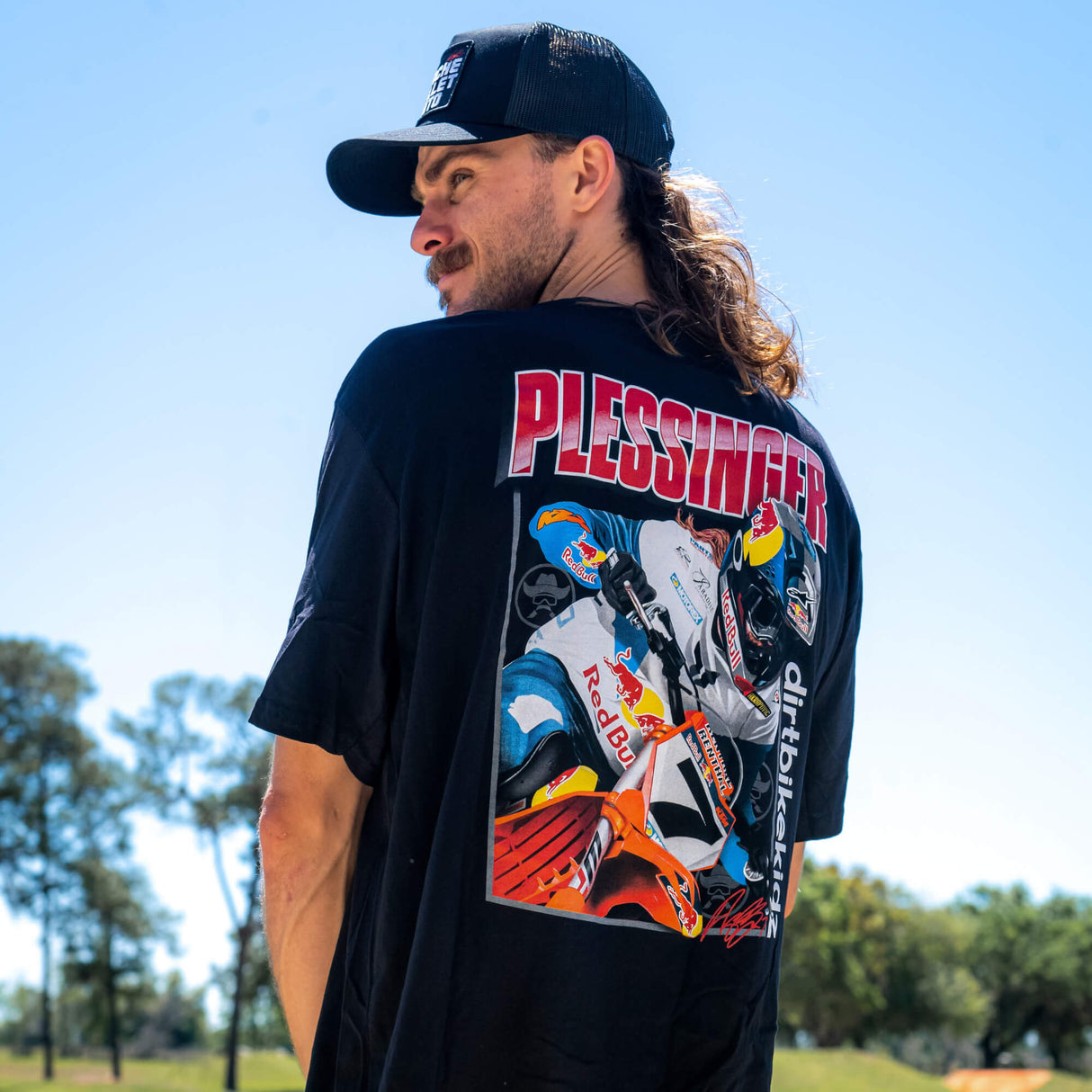 Black AP7 tee with large PLESSINGFER bike graphic on the back