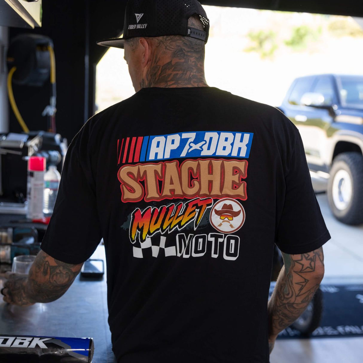 Black Roadhouse AP7 tee, back view with APXDBK Stache Mullet Moto graphic
