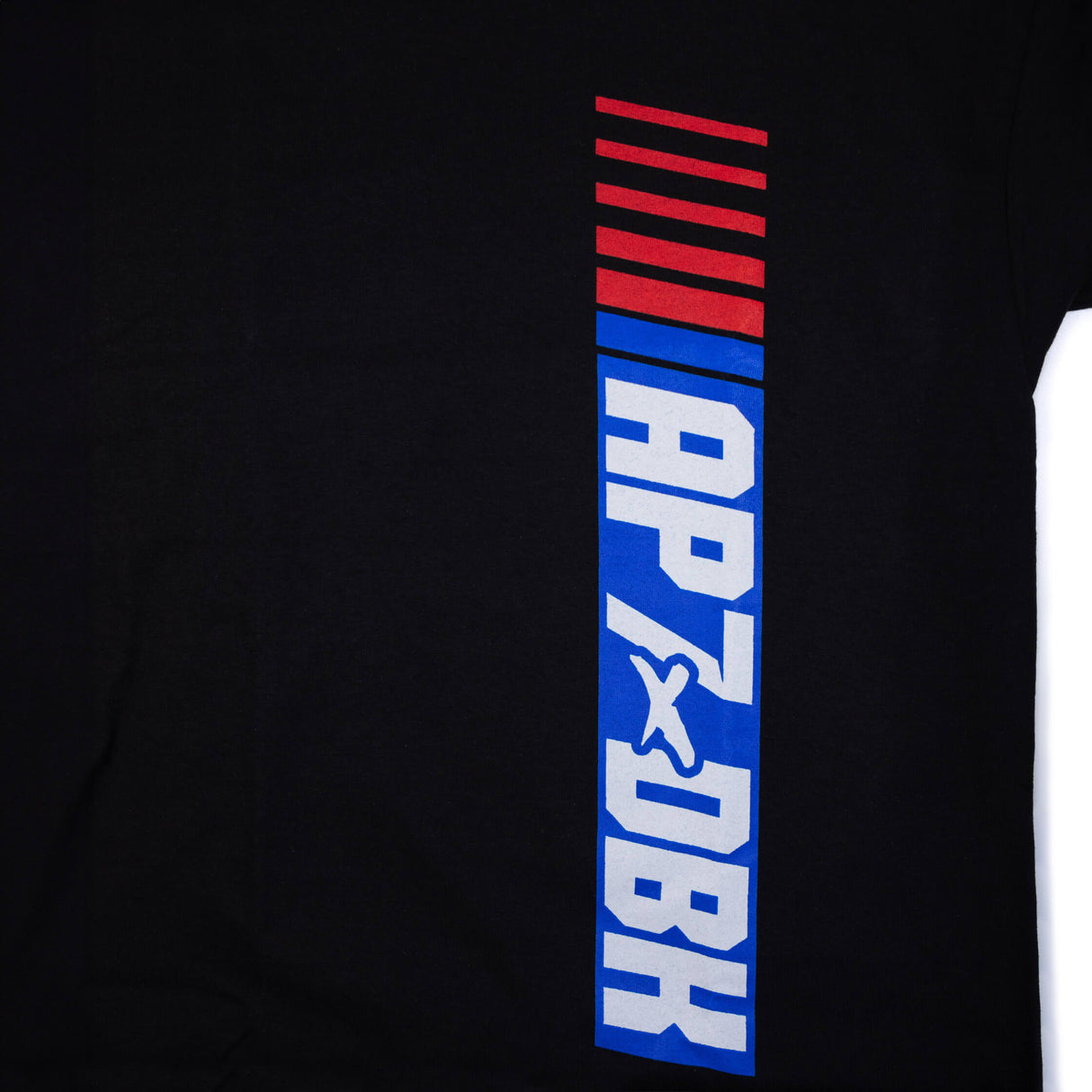 Black tee side close-up featuring vertical APXDBK logo stripes