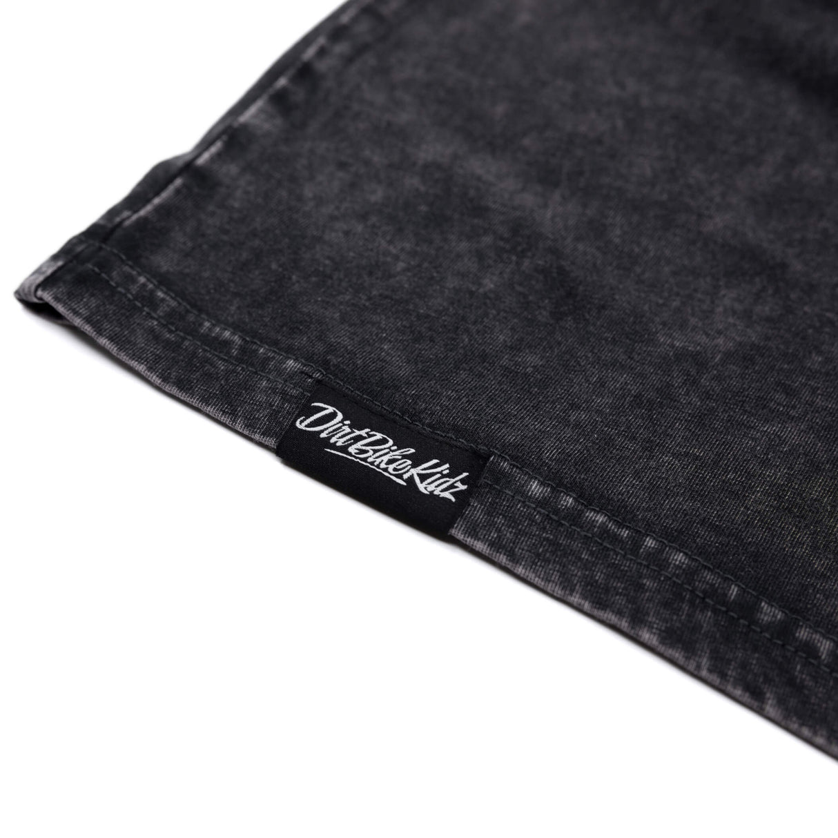 Dark tank top hem with stitched inner label