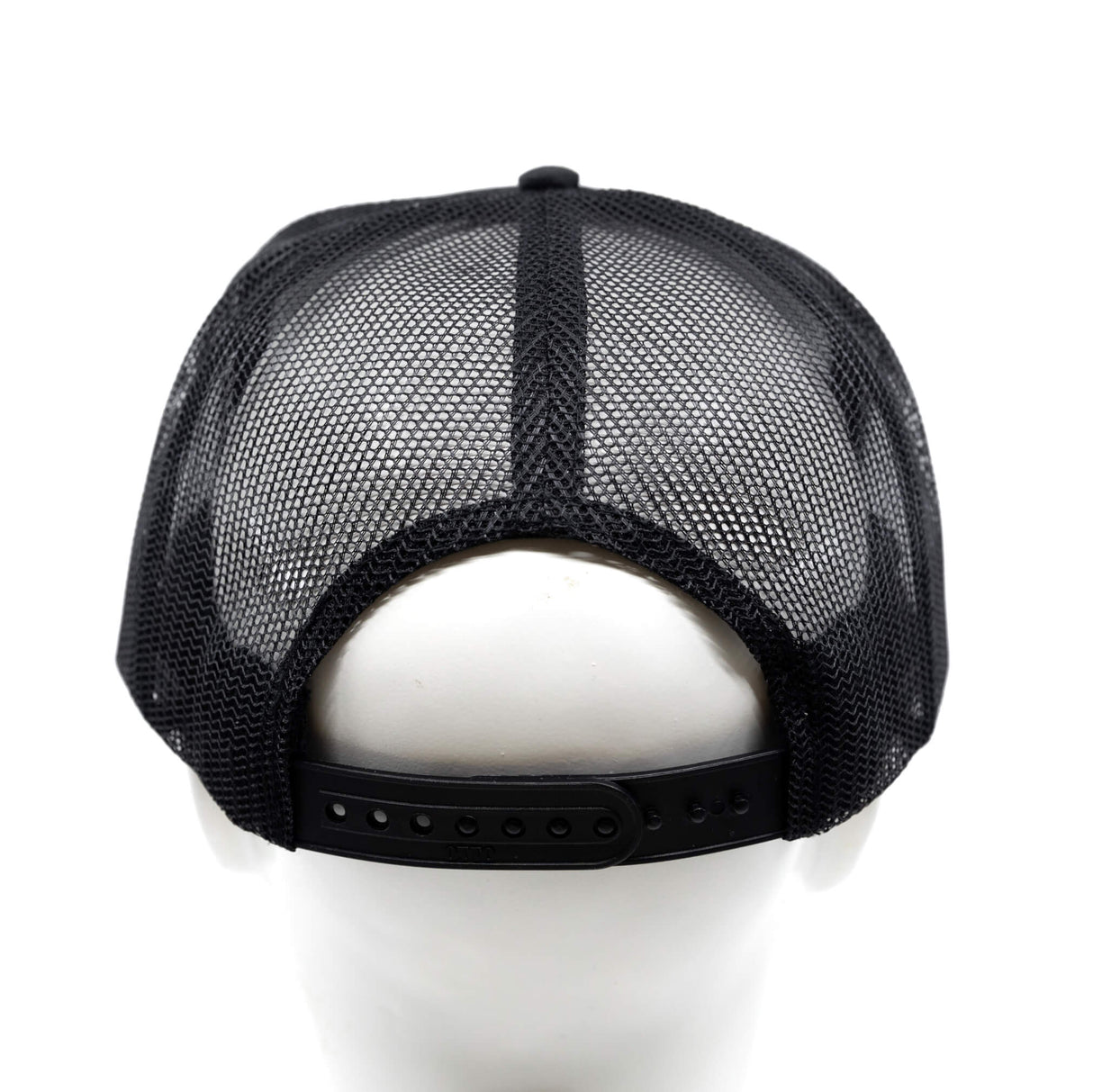 Black mesh trucker hat back with snapback strap, curved brim, front logo not visible