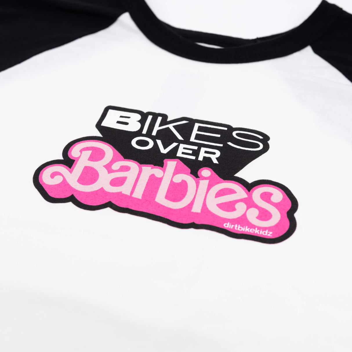 Raglan T-shirt with black neckline and Bikes Over Barbies chest graphic