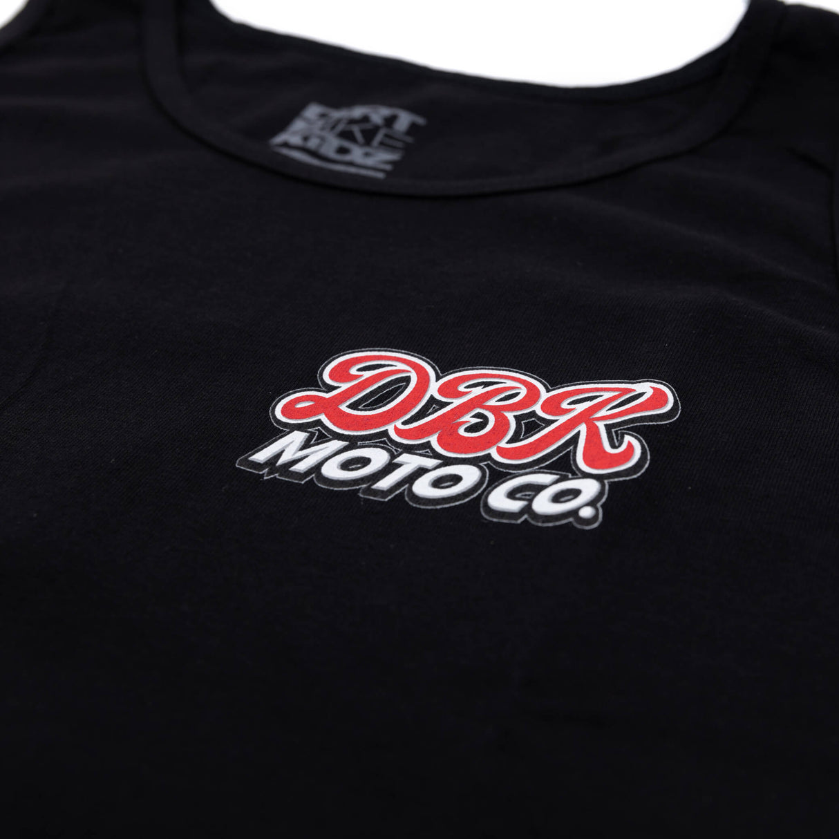 Black tank top neckline with DBR Moto Co logo patch on chest.