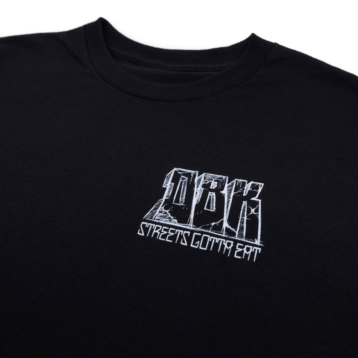 Black graphic T-shirt with back rider and colorful city street illustration, crew neck