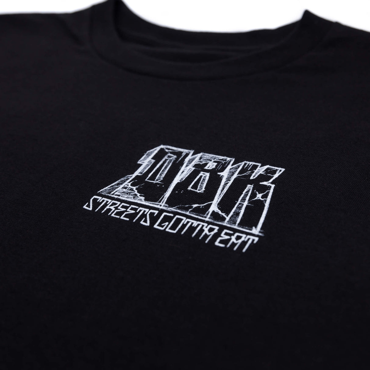 Black T-shirt close-up of white chest logo and stylized text graphic