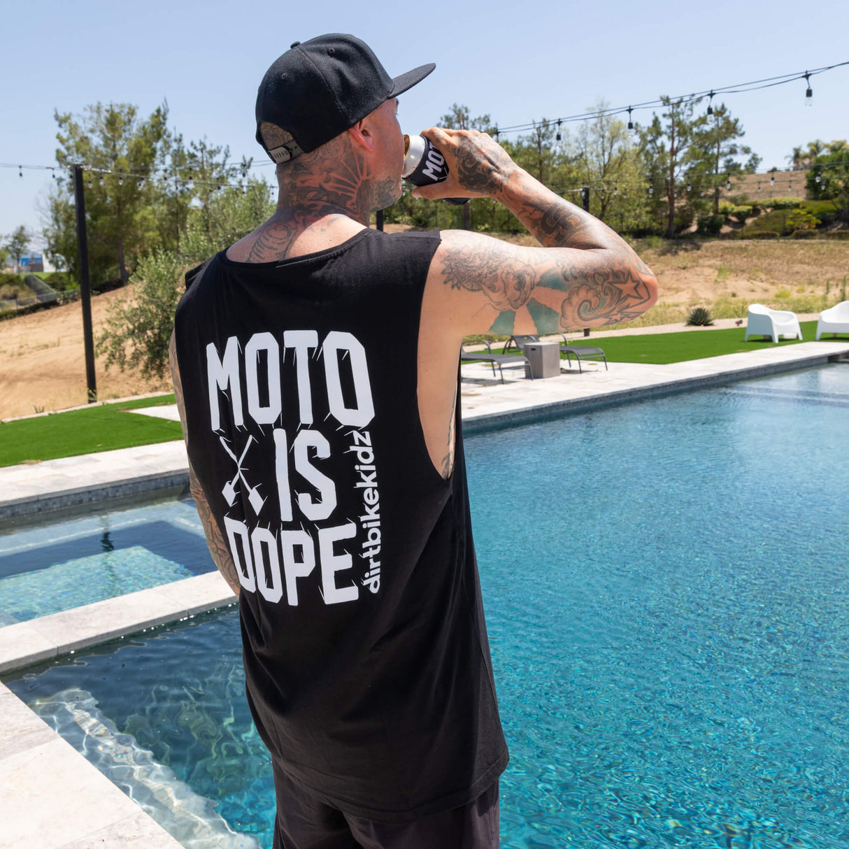 Black tank top back with large 'MOTO IS DOPE' graphic print