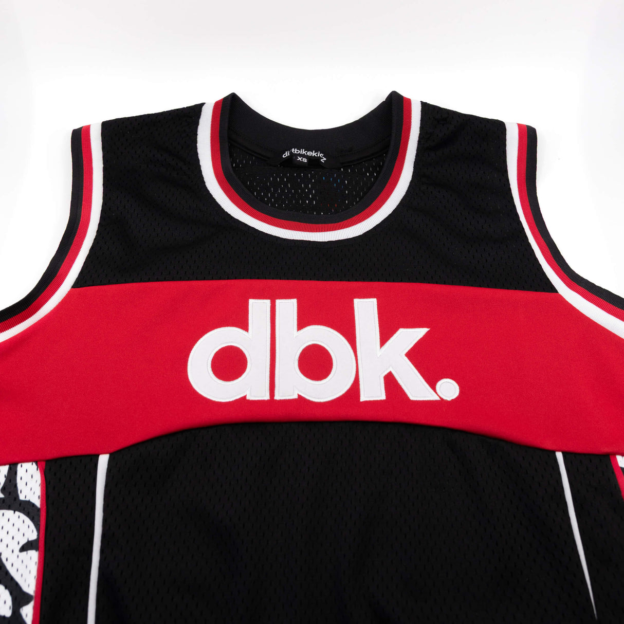 AirMax jersey tank close-up of red dbk logo band on black mesh with white/black trim