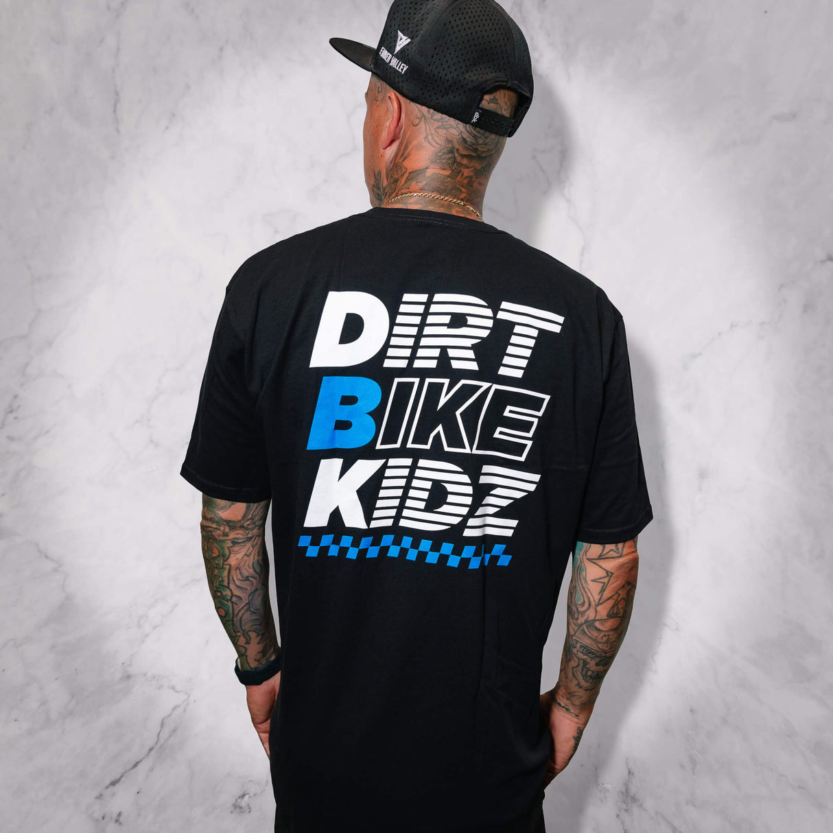 Black Balance Tee back view with DRV BIKE KIDZ large graphic.