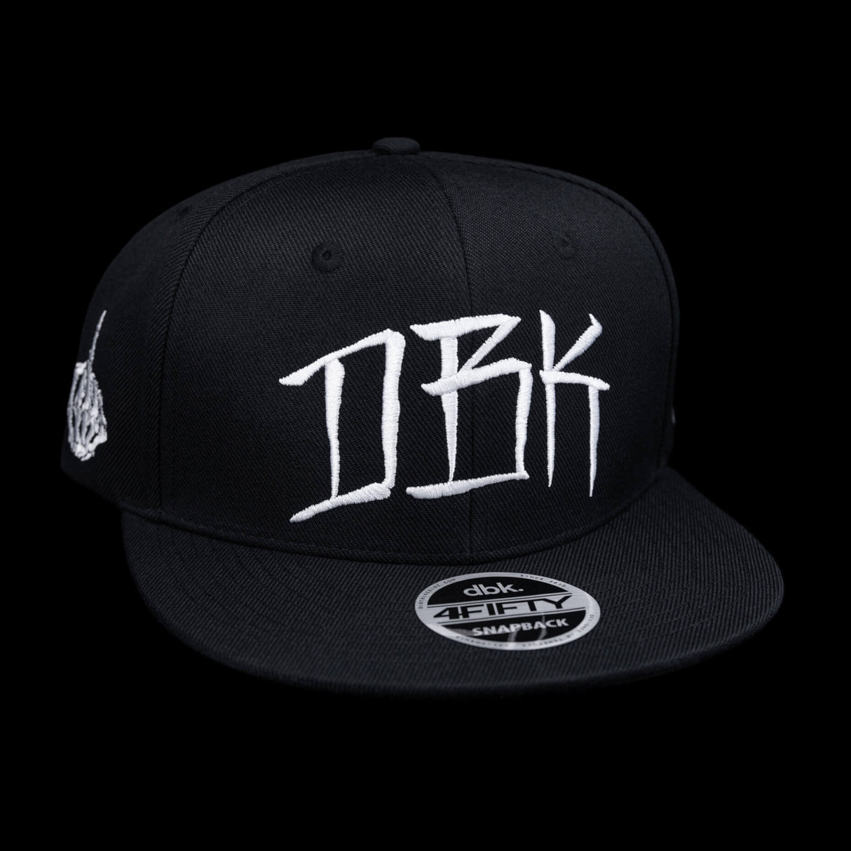Black snapback cap front view with large white DBK graffiti-style logo