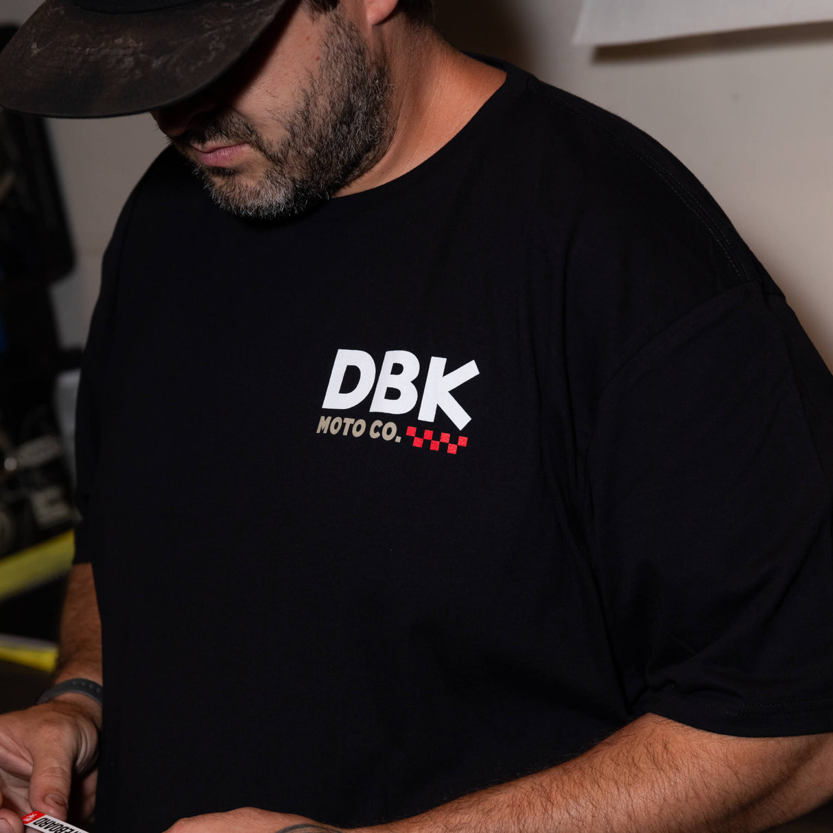 Black T-shirt with DBK Moto Co. logo printed on the chest.