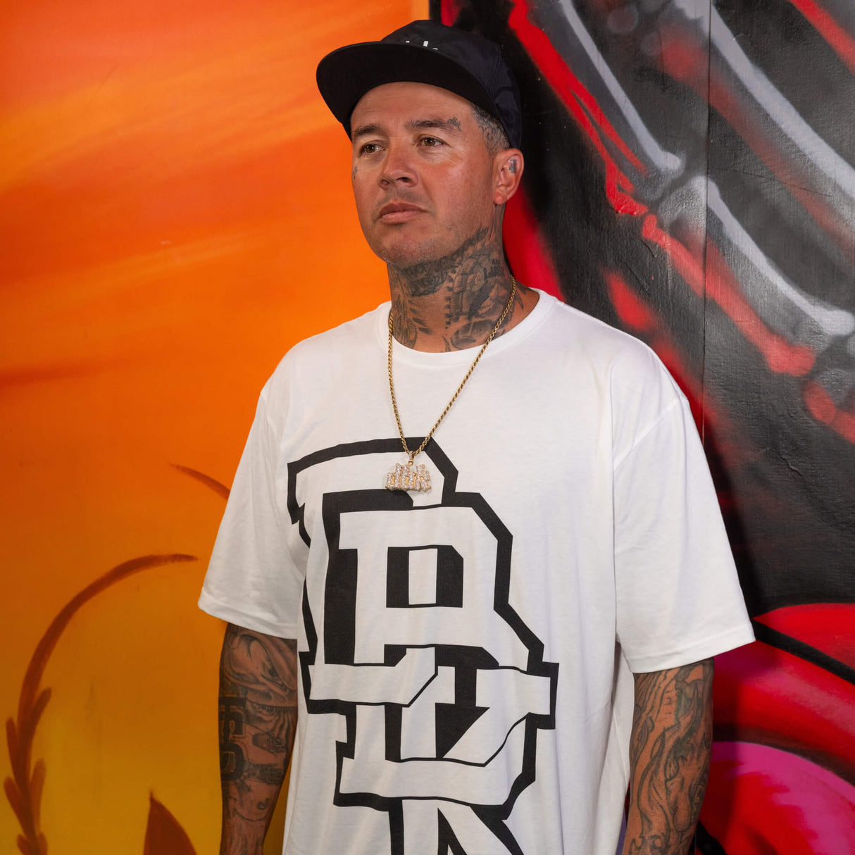White crewneck T-shirt featuring a large black stacked logo graphic on the chest