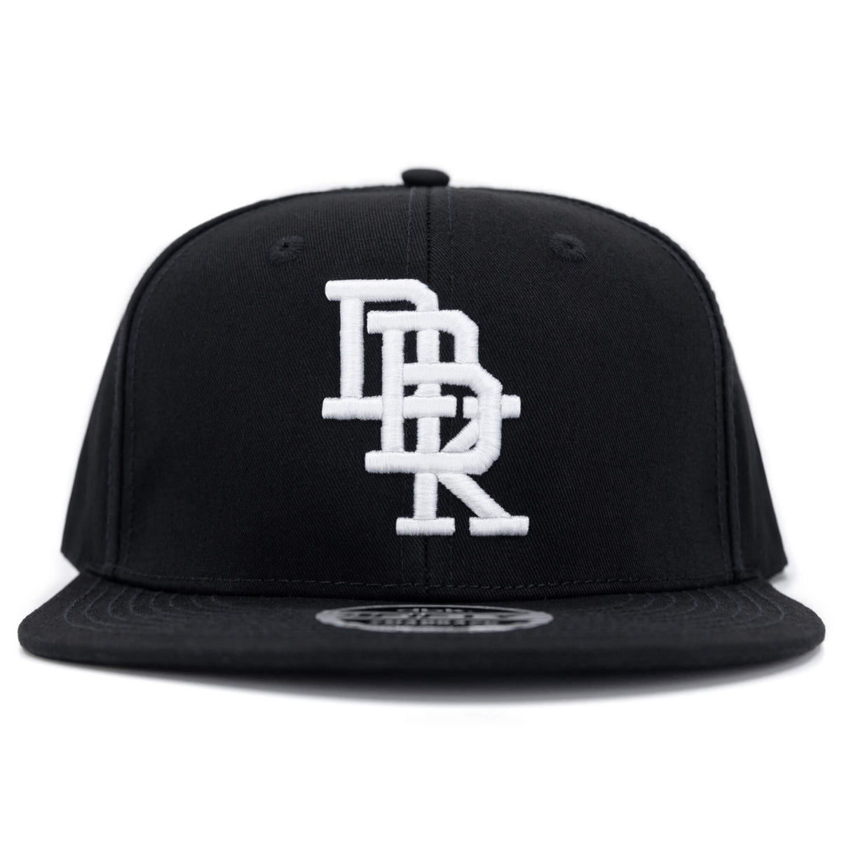 Black snapback cap with centered white embroidered DBK logo and curved brim