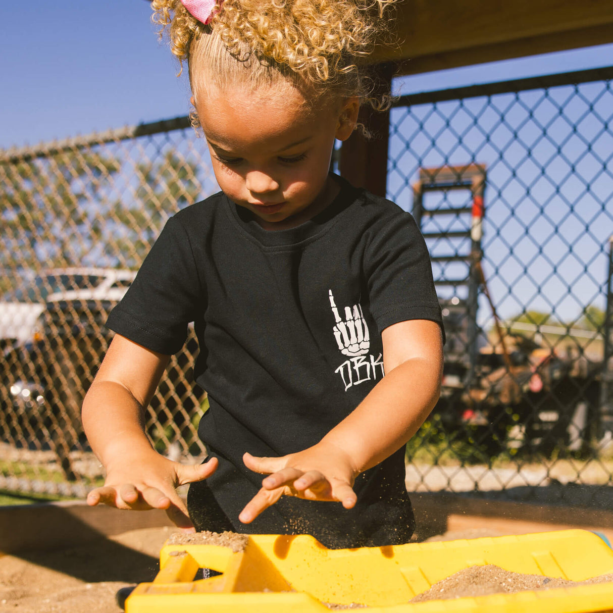 Black toddler T-shirt with white hand logo graphic on the chest