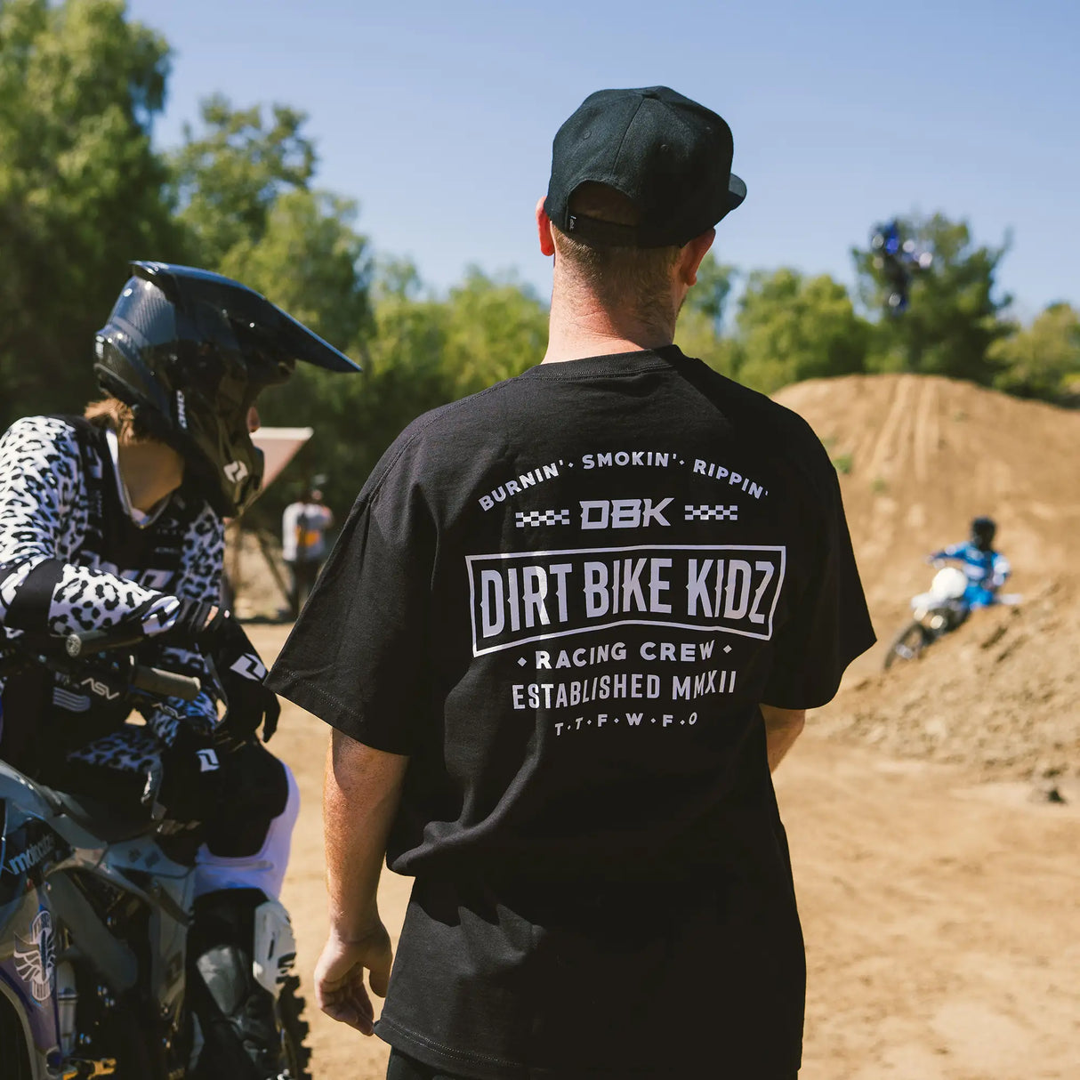 Black crewneck T-shirt with large back “DIRT BIKE KIDZ” graphic