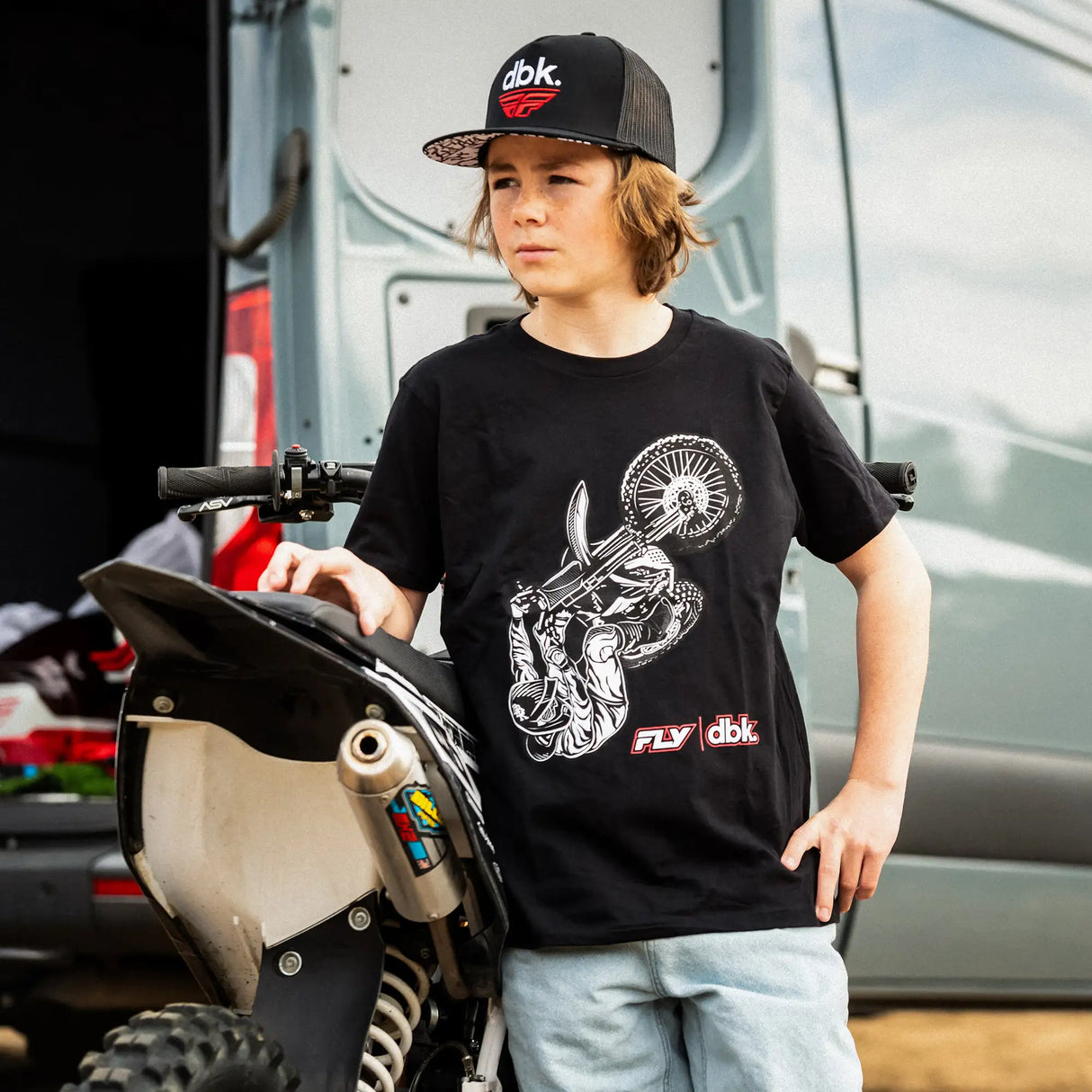 Black youth T-shirt worn with white rider wheel graphic and red FLY dbk chest logo