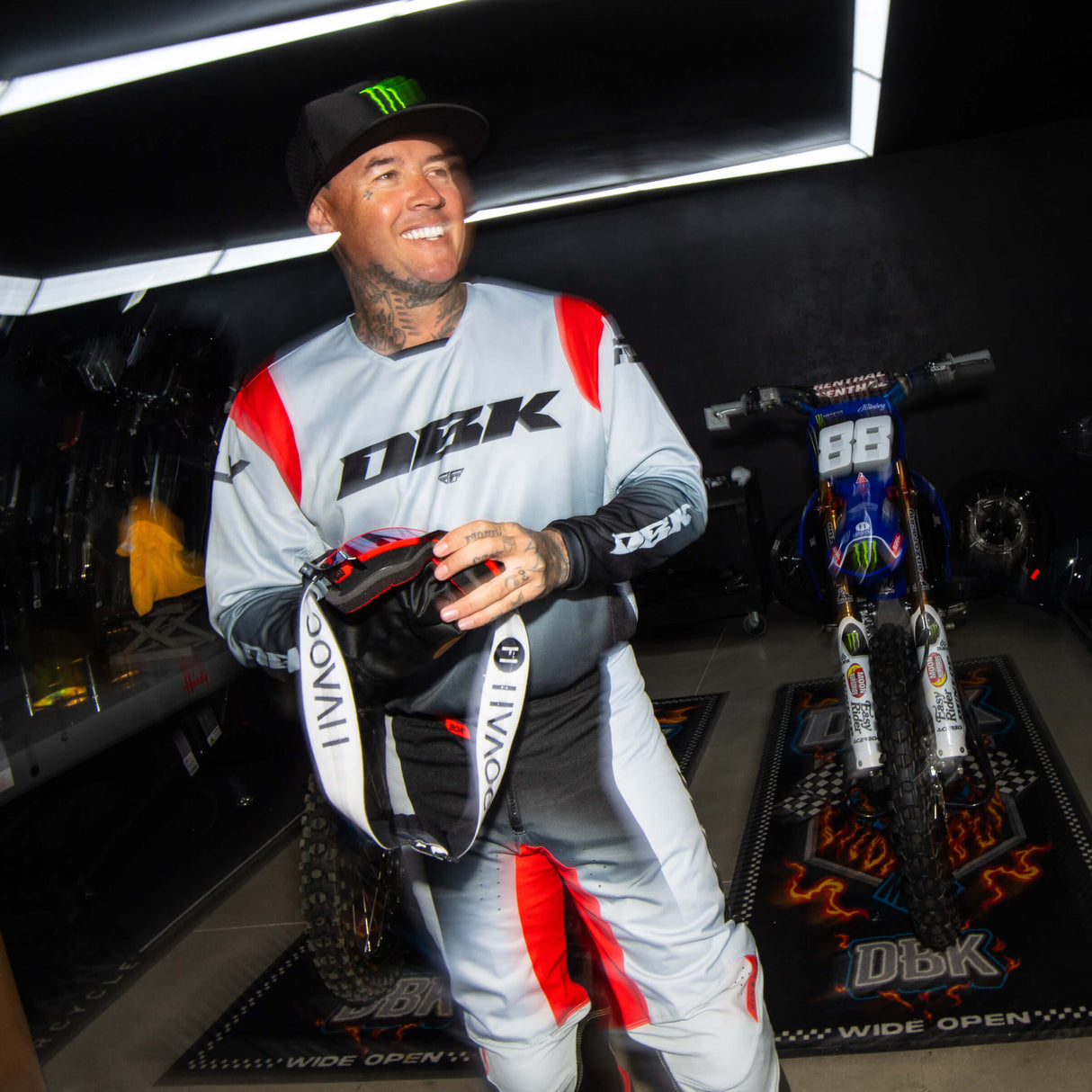 Motocross jersey in light gray and black with red paneling on sleeves and DBK chest logo