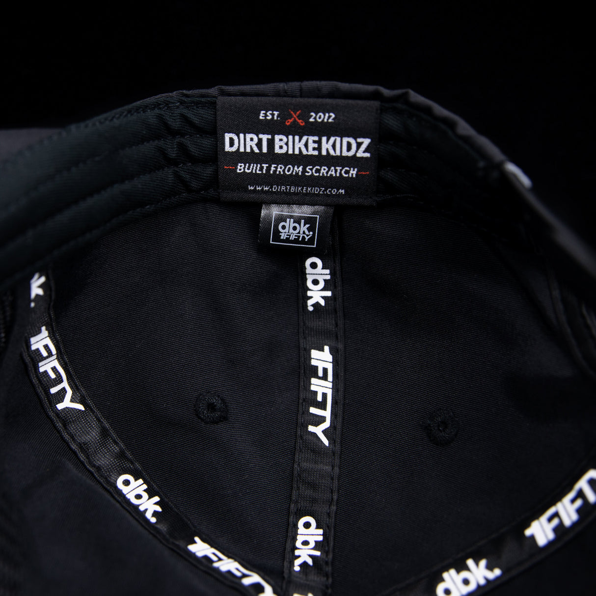 Black cap interior with Dirt Bike Kidz label and stitched panel seams.
