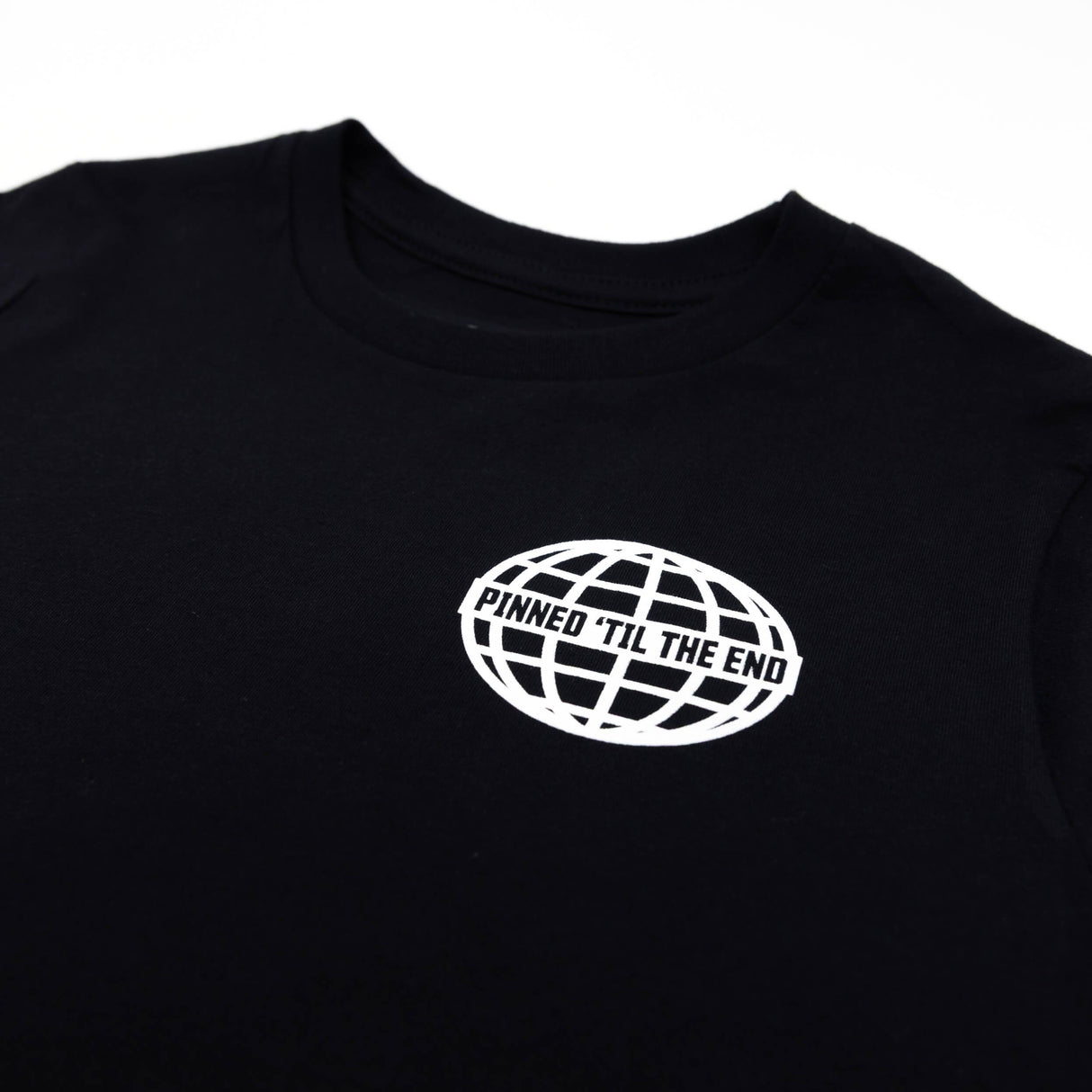 Youth premium T-shirt black with chest globe graphic and "Pinned 'Til the End" text.