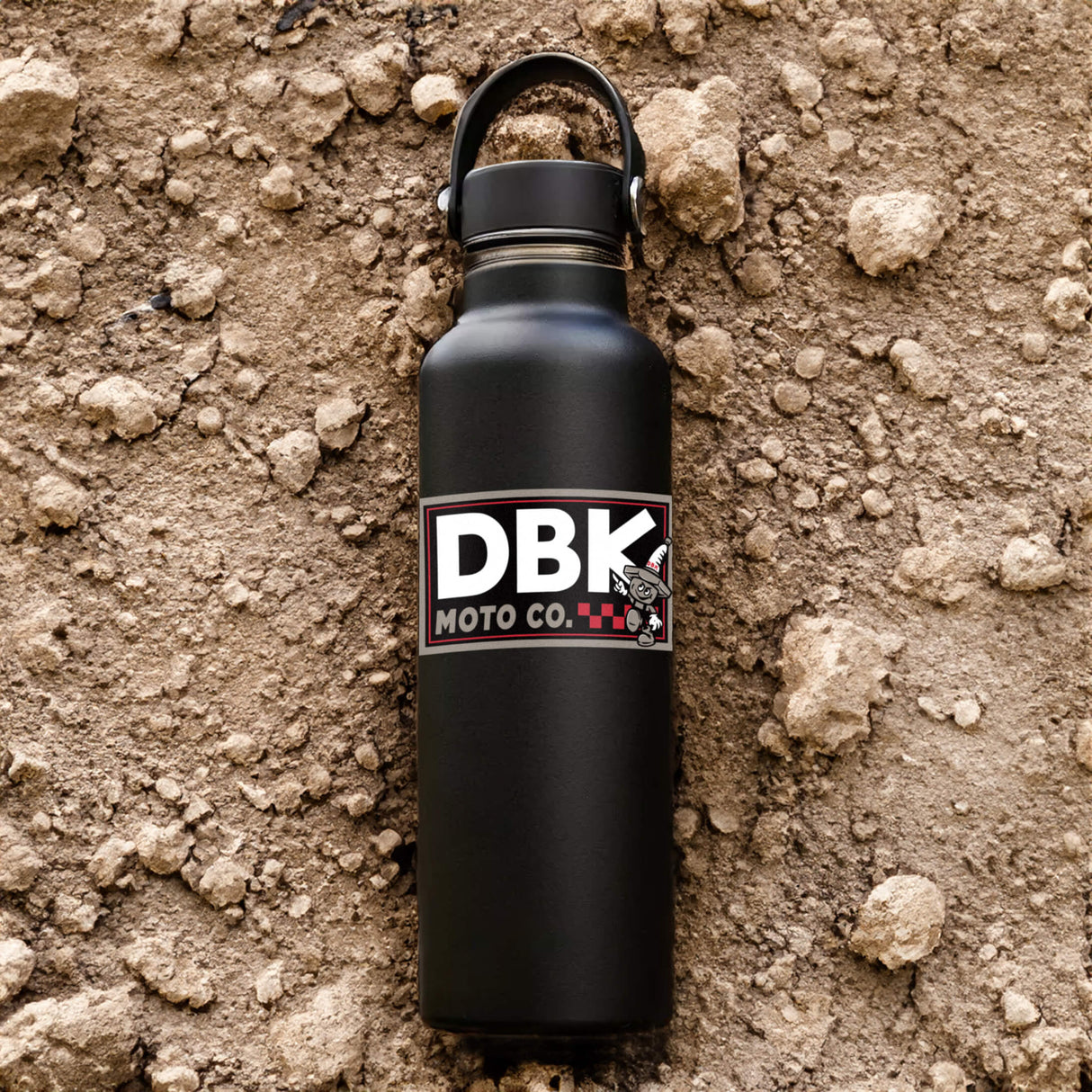 DBK Moto Co sticker on black water bottle, white and red logo with cartoon character
