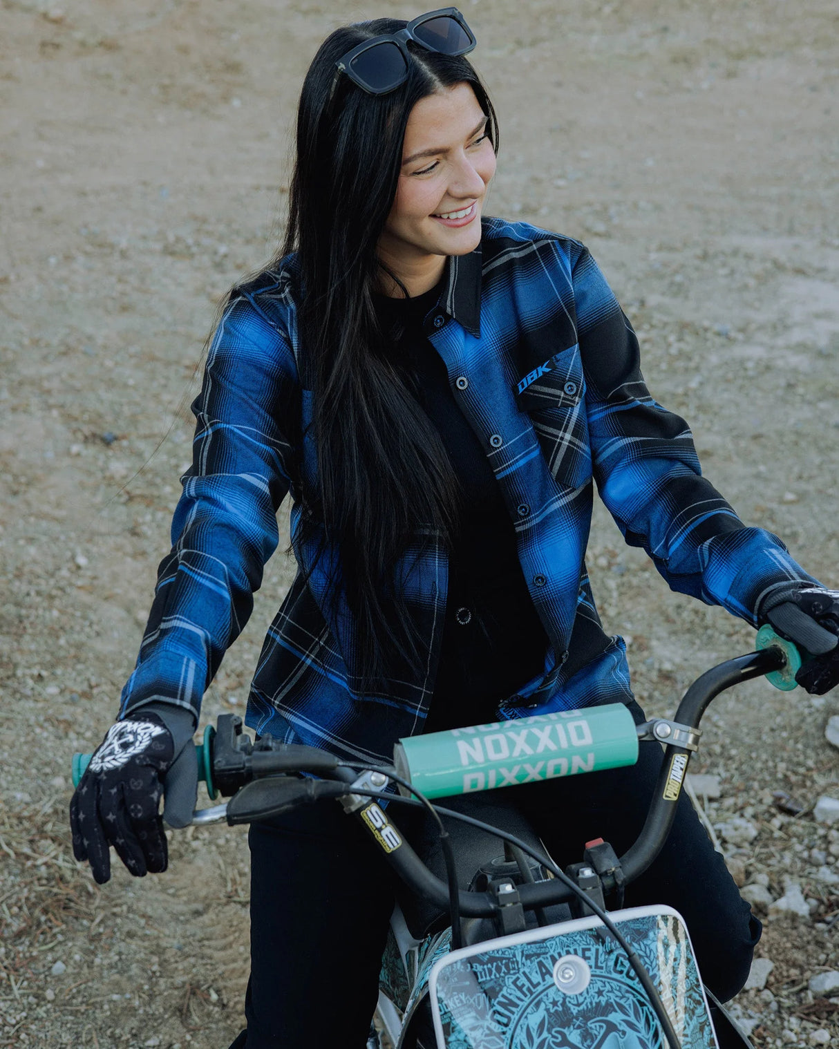 Women’s blue-and-black plaid flannel shirt with button-front and long sleeves