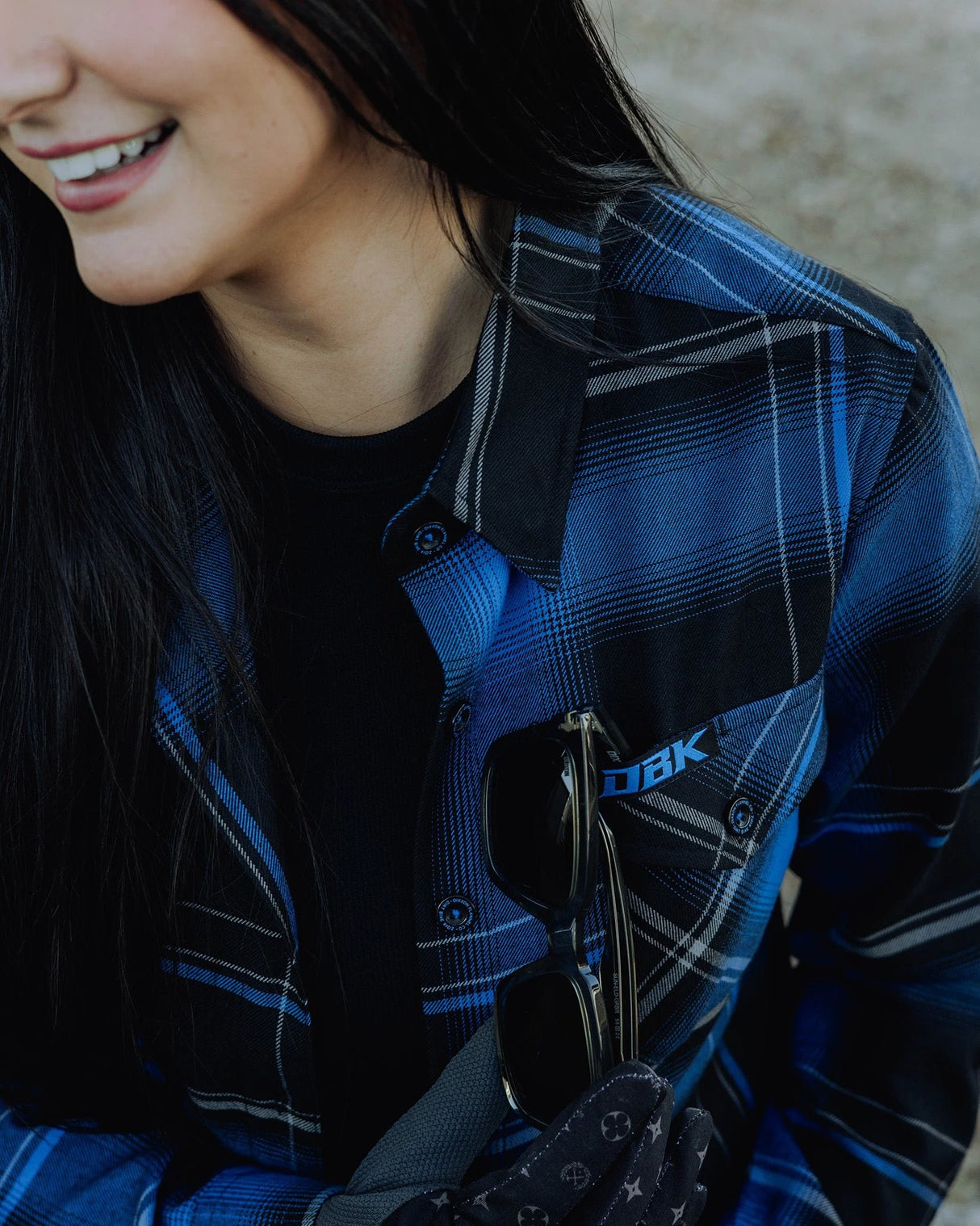 Women’s blue-and-black plaid flannel shirt with button-front and chest patch