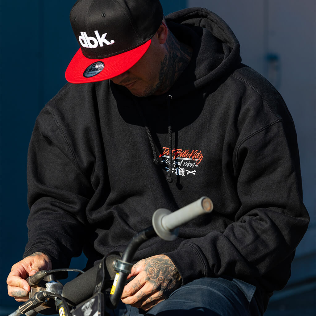 Black hoodie with hood up and small chest graphic logo