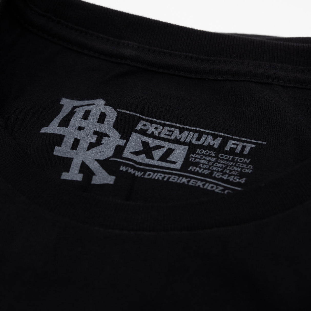 Black crew-neck T-shirt label reads Premium Fit near collar