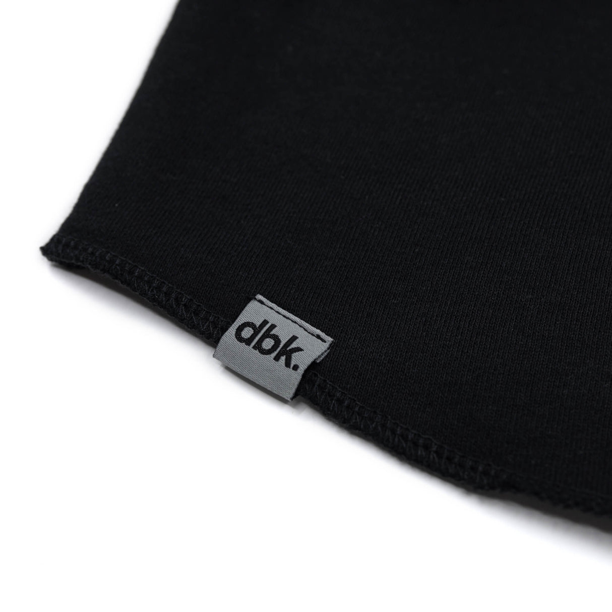 Black hoodie cuff with dbk woven label at the hem