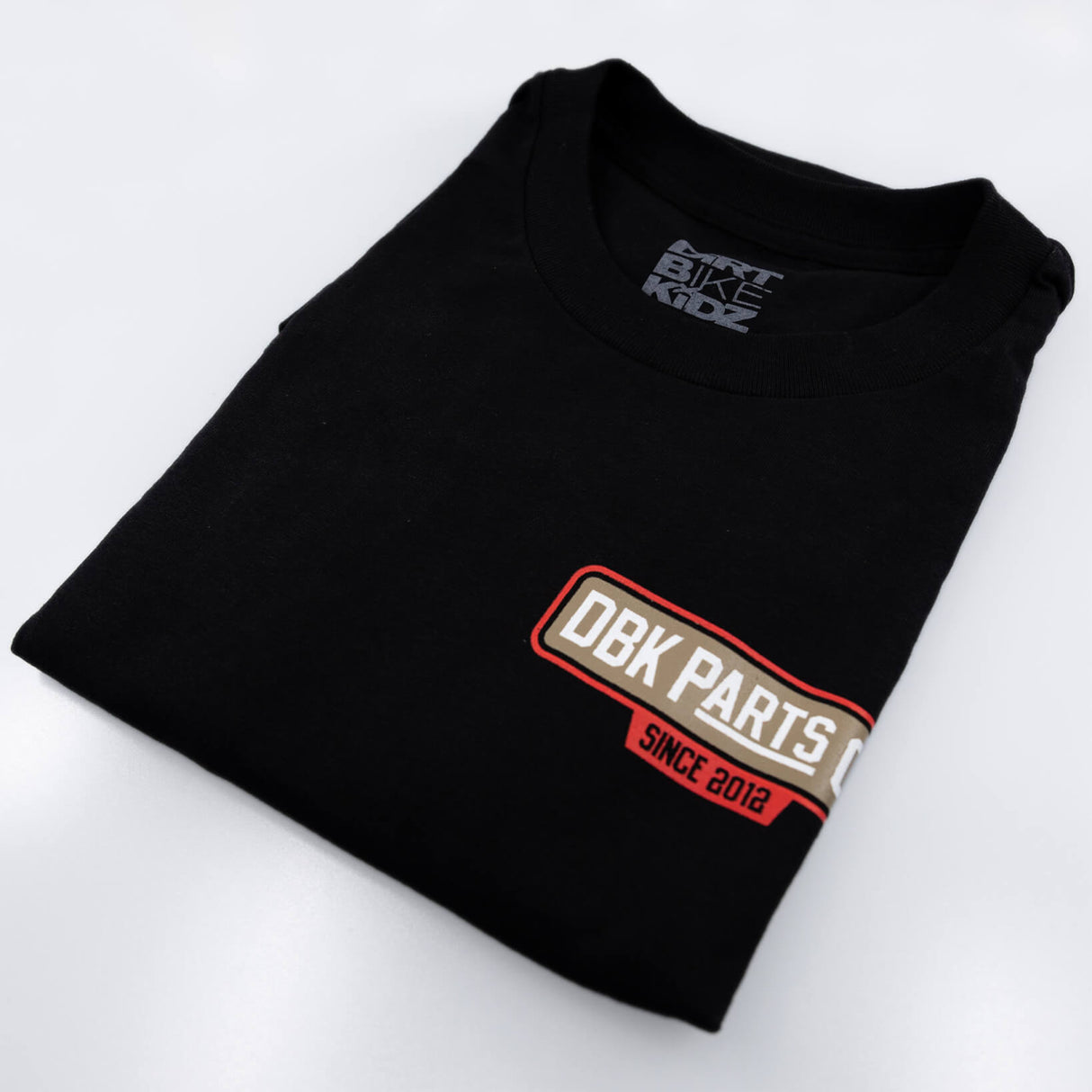 Black youth T-shirt with DBK Parts Co. Since 2012 front badge