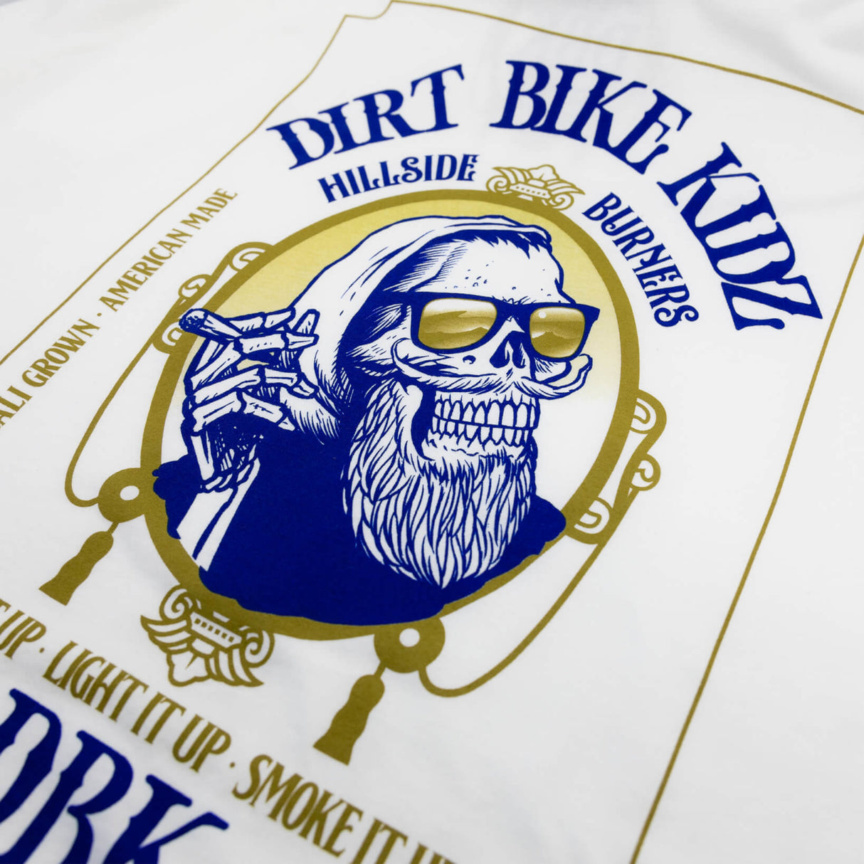 Premium tall tee with large blue skull graphic and gold trim print on front