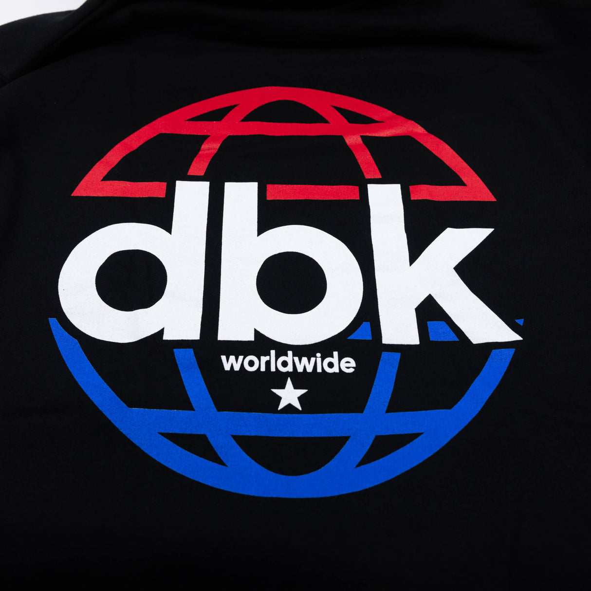 Black hoodie close-up of large “dbk worldwide” logo on the back