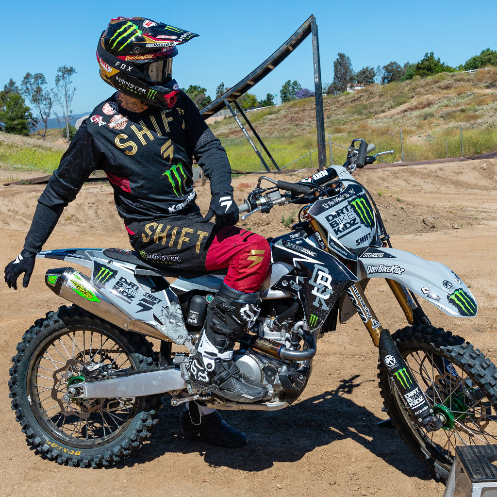 Dirt bike decal set on front fender and side panels with black script and neon green bars