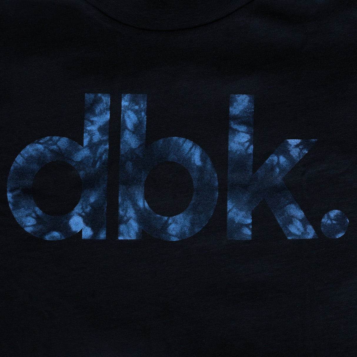 Youth black tank top close-up with blue “DBK” graphic