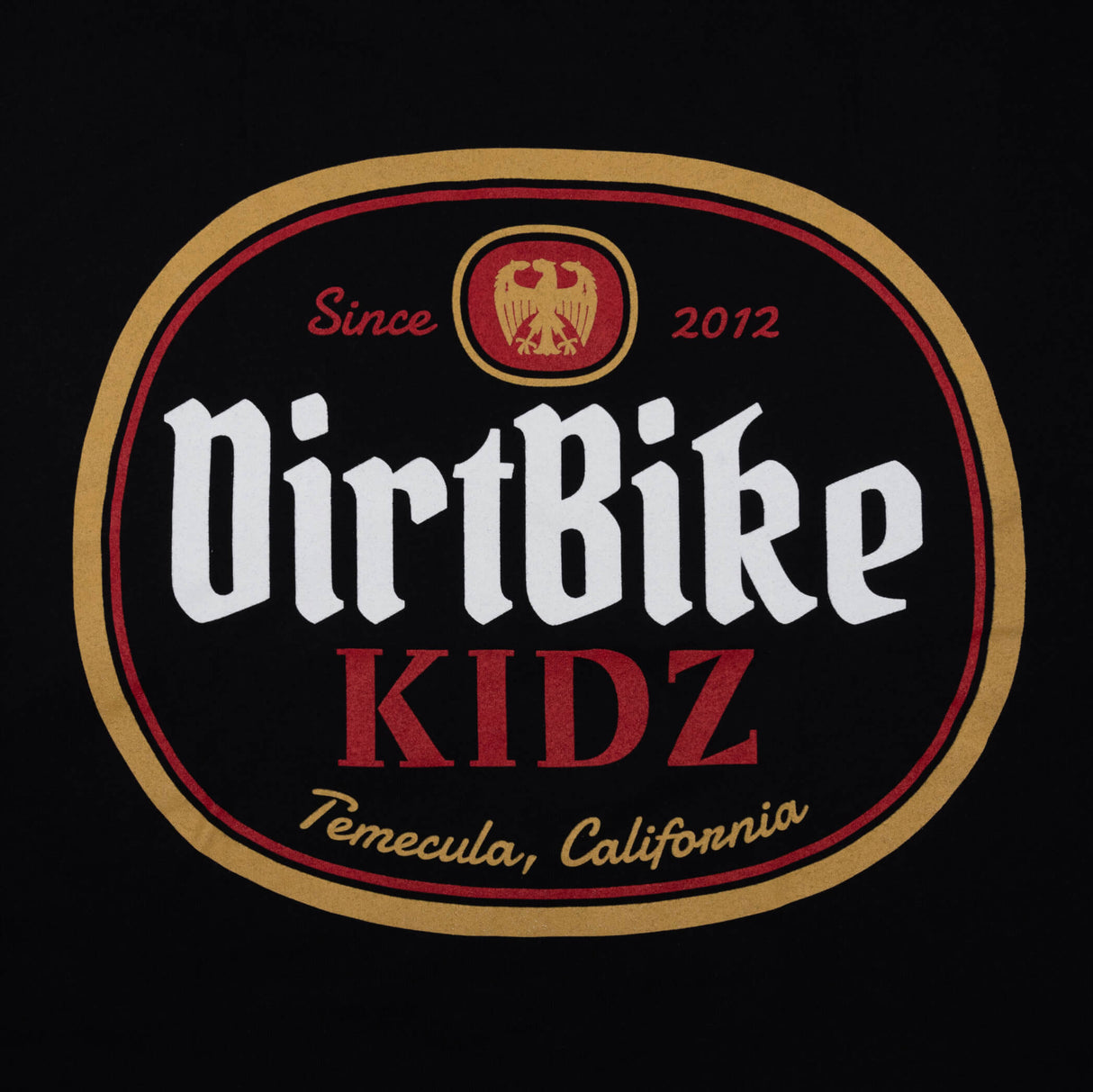 Premium tall tee logo close-up, black fabric with DirtBike KIDZ oval graphic